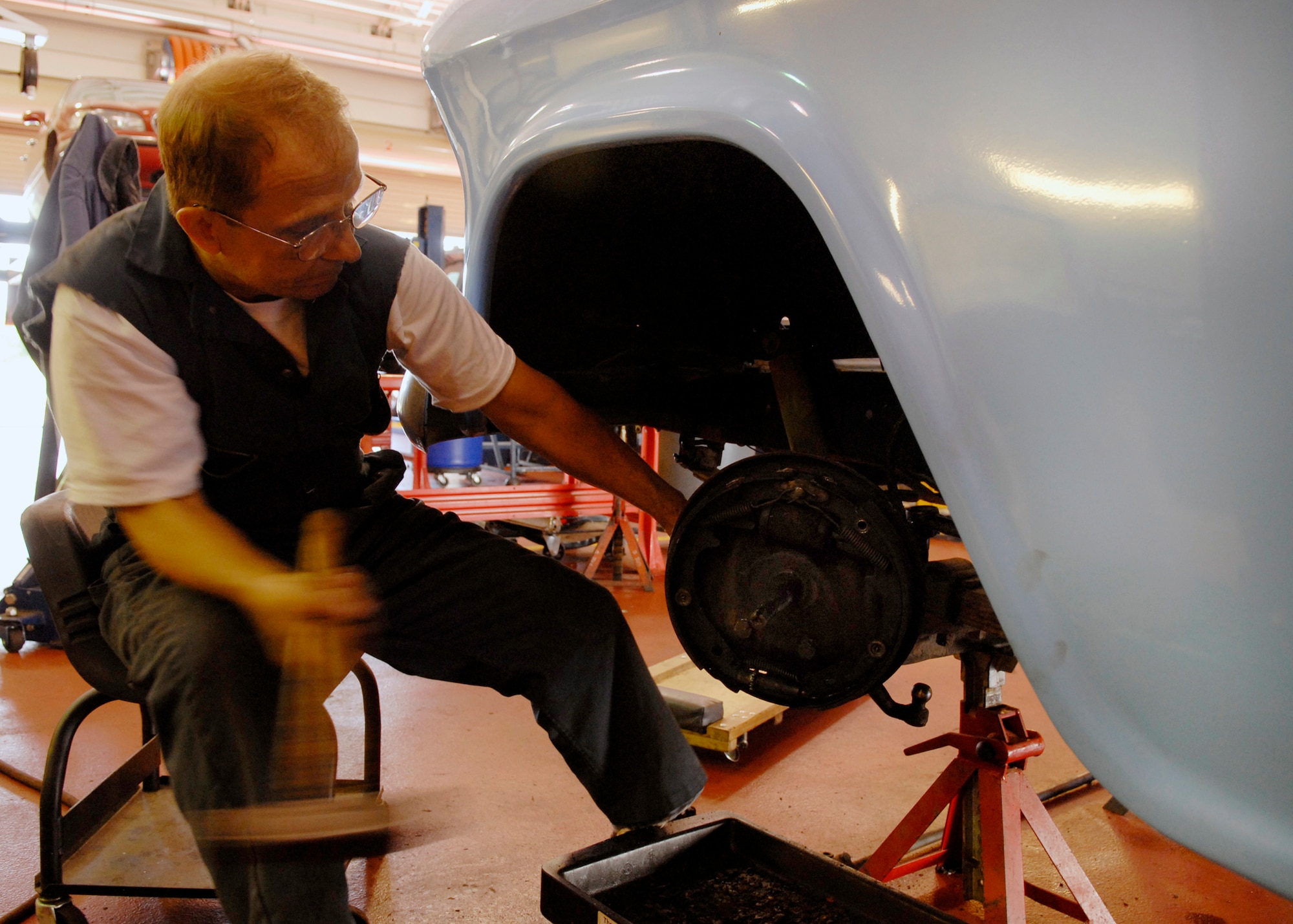 VANDENBERG AIR FORCE BASE, Calif. -- Frank Bagley, 30th Civil Engineer Squadron contractor and former Marine, works on his 1956 baby blue Chevrolet 3100 at the Auto Skills Center here July 30.  (U.S. Air Force photo/Airman 1st Class Andrew Satran)