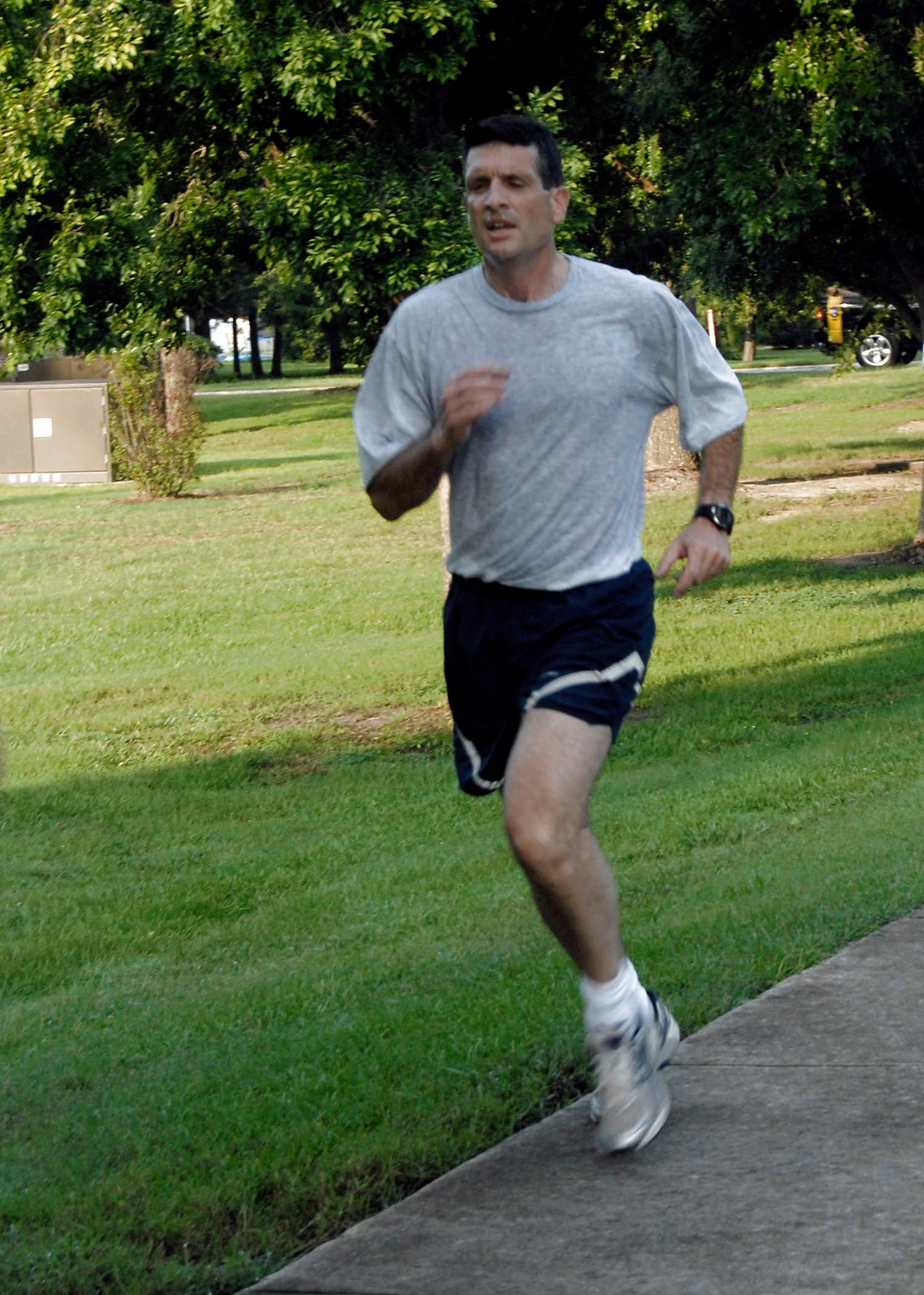 Col. Joseph Mancy runs to the finish line during a commander's 5,000 meter run fitness challenge on Charleston Air Force Base, S.C., Aug. 1.  Colonel Mancy is 47 years old and recently scored 100 percent in the 25-and-under category on his physical fitness test. He is the 437th Operations Group commander. (U.S. Air Force photo/Airman 1st Class Cynthia Spalding)