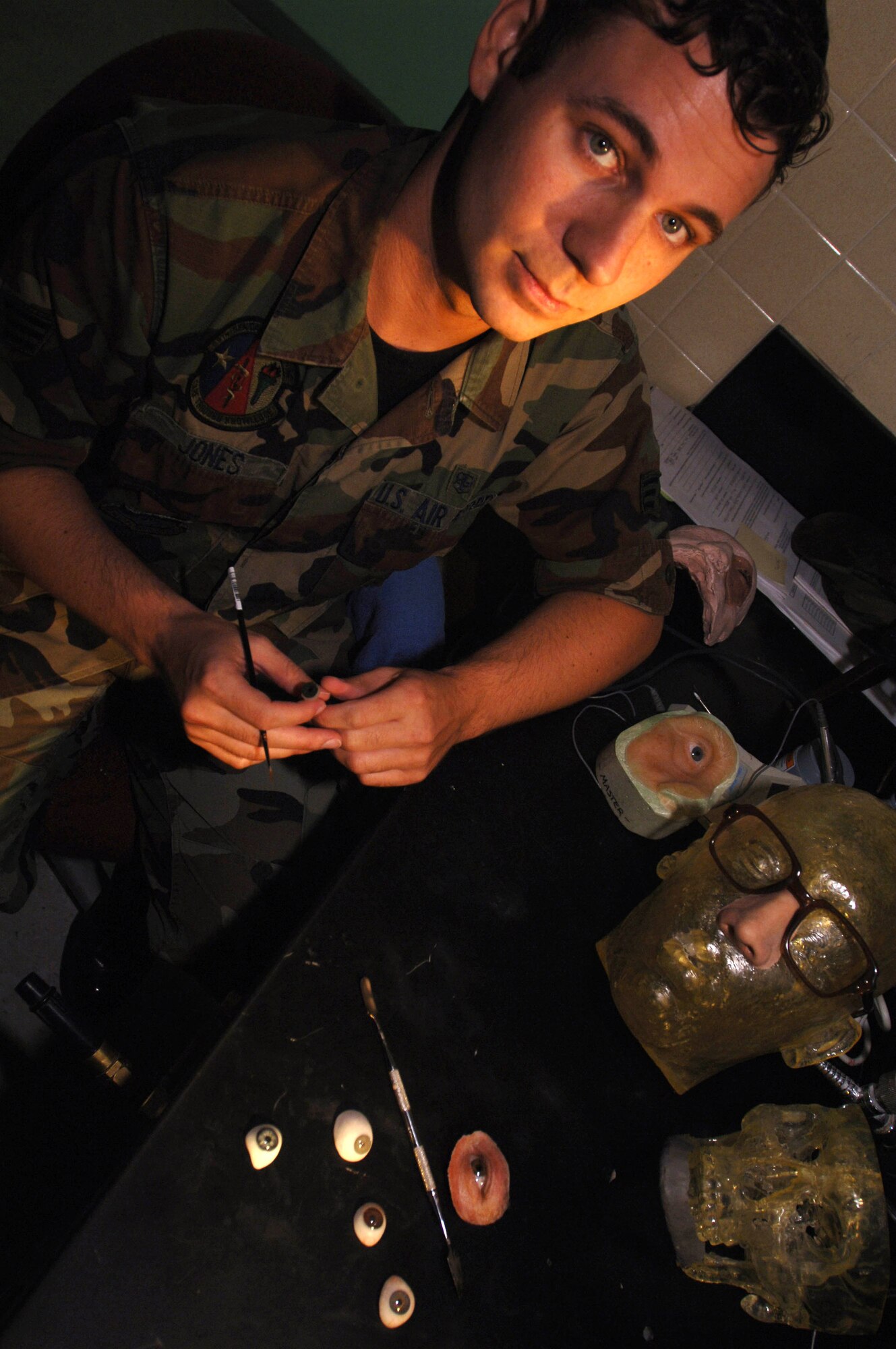 Maxillofacial prosthetic technician Senior Airman Justin Jones creates new facial features using various techniques and tools to reconstruct facial features of wounded warriors. His techniques are used to aid patients in their physical and psychological recovery from injuries to the neck and face. Airman Jones is assigned to the 59th Dental Squadron at Lackland Air Force Base, Texas. (U. S. Air Force photo/Staff Sgt. Erin Peterson)