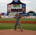 Senior Airman James Heathcoat, 12th Operations Support Squadron throws out the first pitch at a San Antonio Mission's baseball game Aug. 6. Capt. Deric Prescott sang the national anthem, the honor guad presented the colors and Airman Heathcoat threw the first pitch. The Missions gave military members and their family members up to ten ticket vouchers through the base Information, Tickets and Travel office. Another military appreciation night is Aug. 20 and tickets are available from ITT in Bldg. 897. (U.S. Air Force photo by Ed McDaniel)