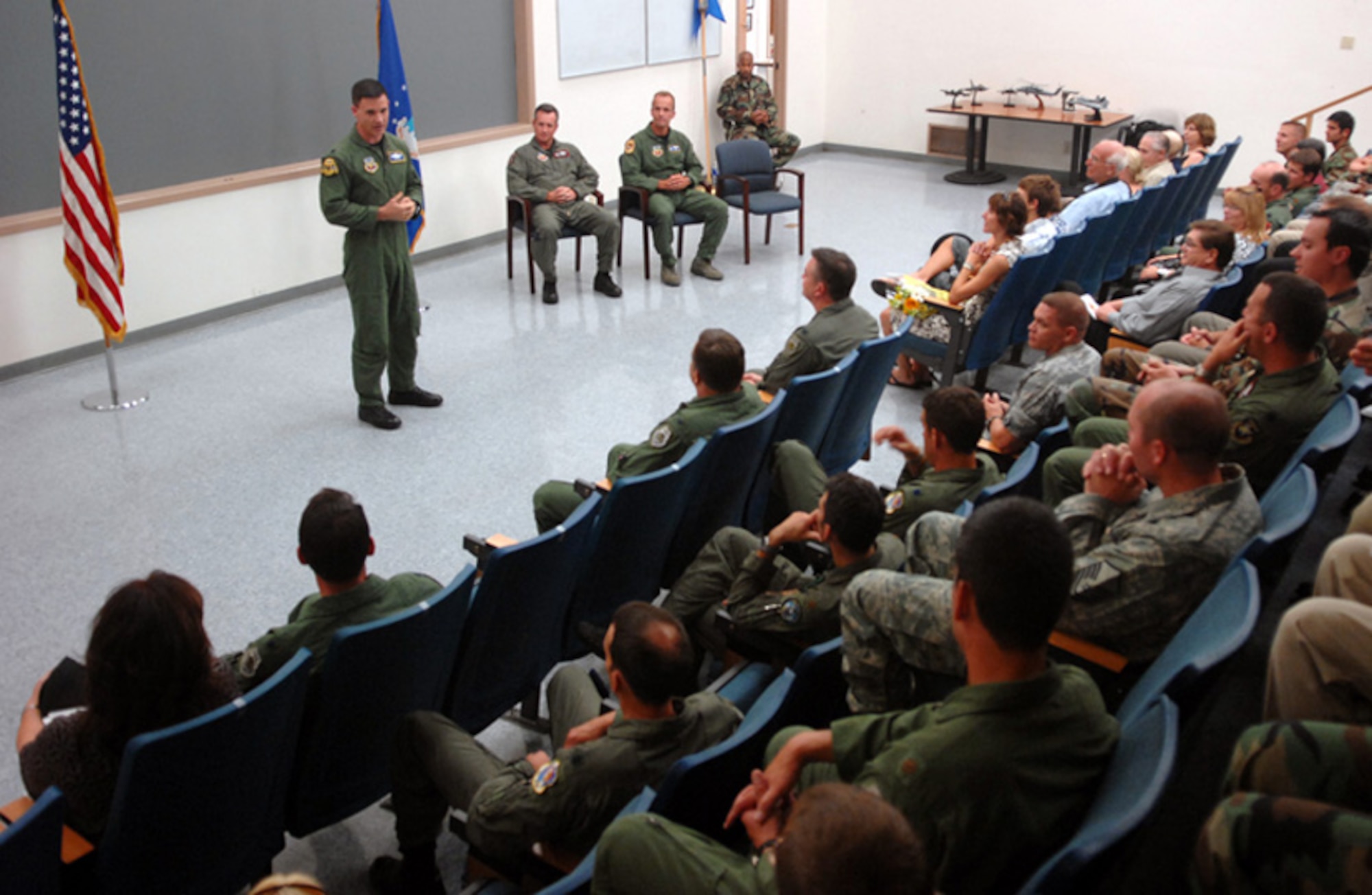 Lt. Col. William Tracy addresses his new squadron after taking command of the 59th Test and Evaluation Squadron during a ceremony held Aug. 1 at Nellis Air Force Base, Nev.  Lt. Col. Daniel Holmes relinquished command.  U.S. Air Force photo.