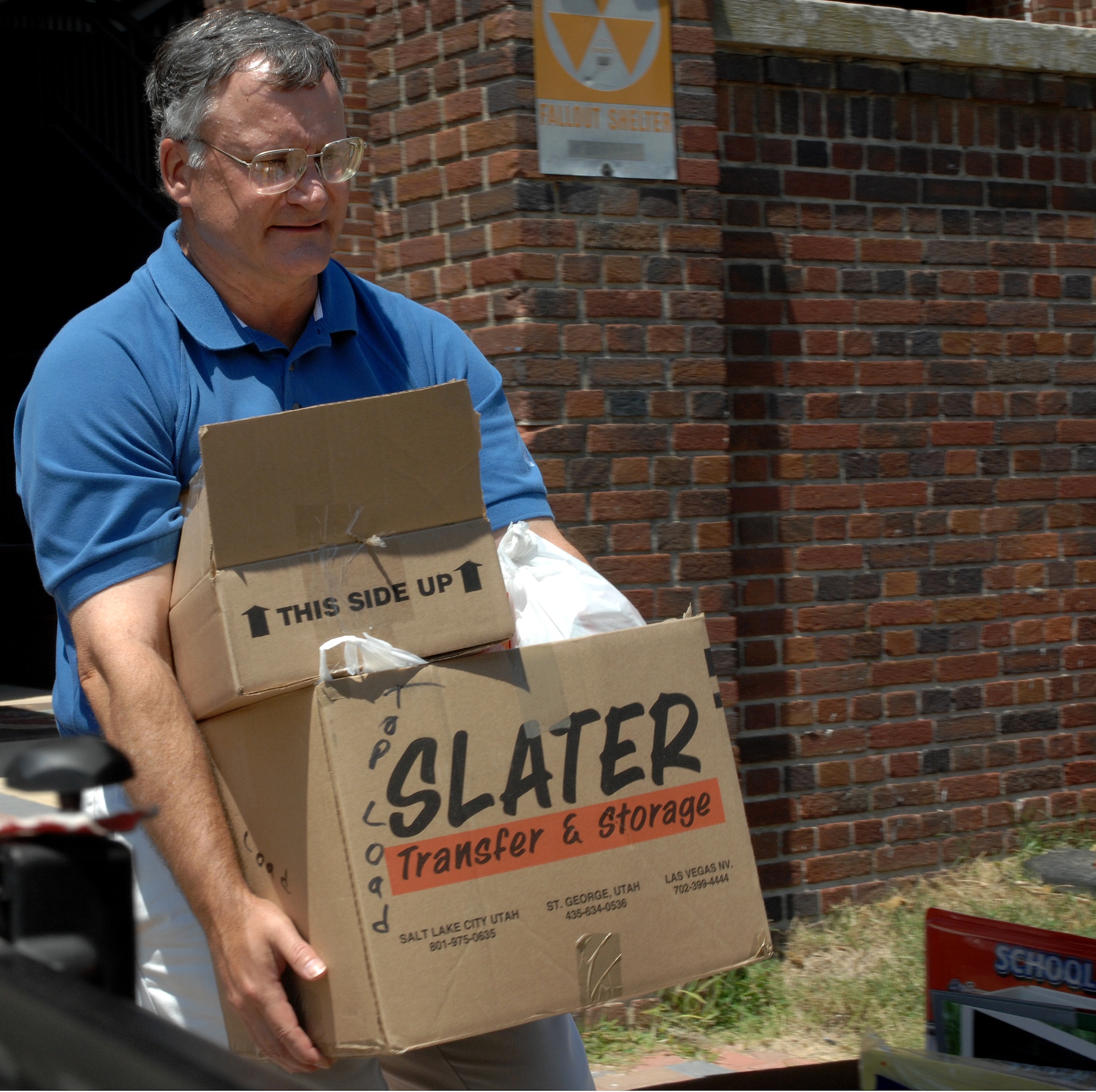 LANGLEY AIR FORCE BASE, Va. – Mr. Bob Anderson, 1st Comptroller Squadron, loads school supplies in one of two trucks Aug. 8.  The  American Society of Military Comptrollers collected two truck loads and one car full of school supplies for the Salvation Army to distribute to children in Hampton, Newport News, Poquoson and lower York County areas.  Langley agencies along with some Navy and Coast Guard are some of the groups that helped ASMC collect all the school supplies.  (U.S. Air Force photo/Airman 1st Class Zachary Wolf)