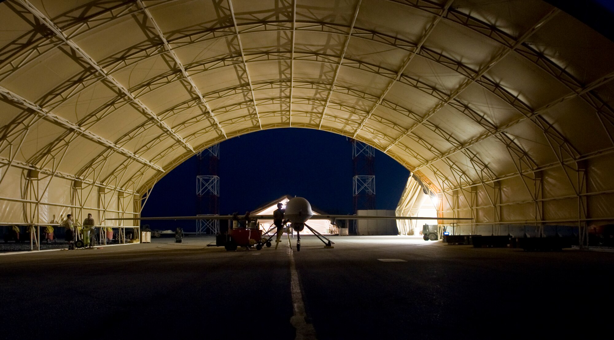 ALI BASE, Iraq -- An MQ-1B Predator, assigned to Detachment 1, 46th Expeditionary Reconnaissance Squadron, goes through post-flight maintenance Aug. 11, 2008. Through the use of advanced capabilities, focused doctrine and detailed training, the Predator provides integrated and synchronized close-air combat operations, to include intelligence, surveillance and reconnaissance. (U.S. Air Force photo/Airman 1st Class Christopher Griffin)