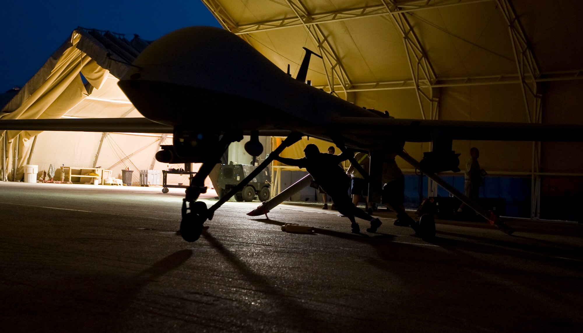 ALI BASE, Iraq -- An MQ-1B Predator, assigned to Detachment 1, 46th Expeditionary Reconnaissance Squadron here, goes through post-flight maintenance Aug. 11, 2008. Through the use of advanced capabilities, focused doctrine and detailed training, the Predator provides integrated and synchronized close-air combat operations, to include intelligence, surveillance and reconnaissance. (U.S. Air Force photo/Airman 1st Class Christopher Griffin)
