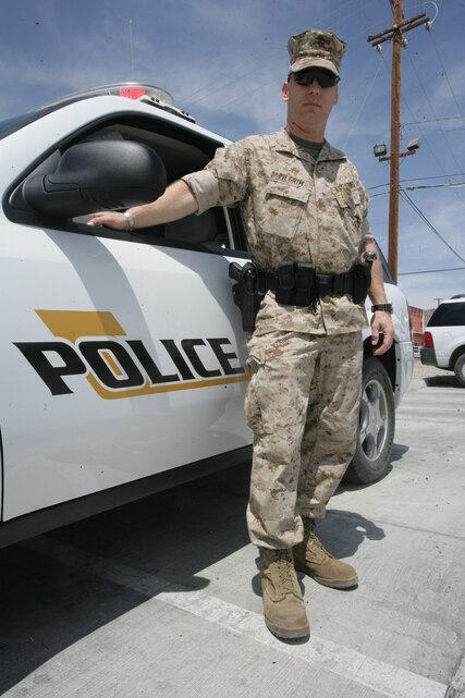 Chief Warrant Officer 2 Danny E. Pilgrim stands in front of a Provost Marshal’s Office vehicle at the Unit Marshalling Area Wednesday. Pilgrim is the only Marine currently participating in the Auxiliary Marine Program with PMO. Pilgrim has been an Auxiliary Marine since 1997, when he was a corporal stationed at Marine Corps Base Camp Pendleton, Calif.