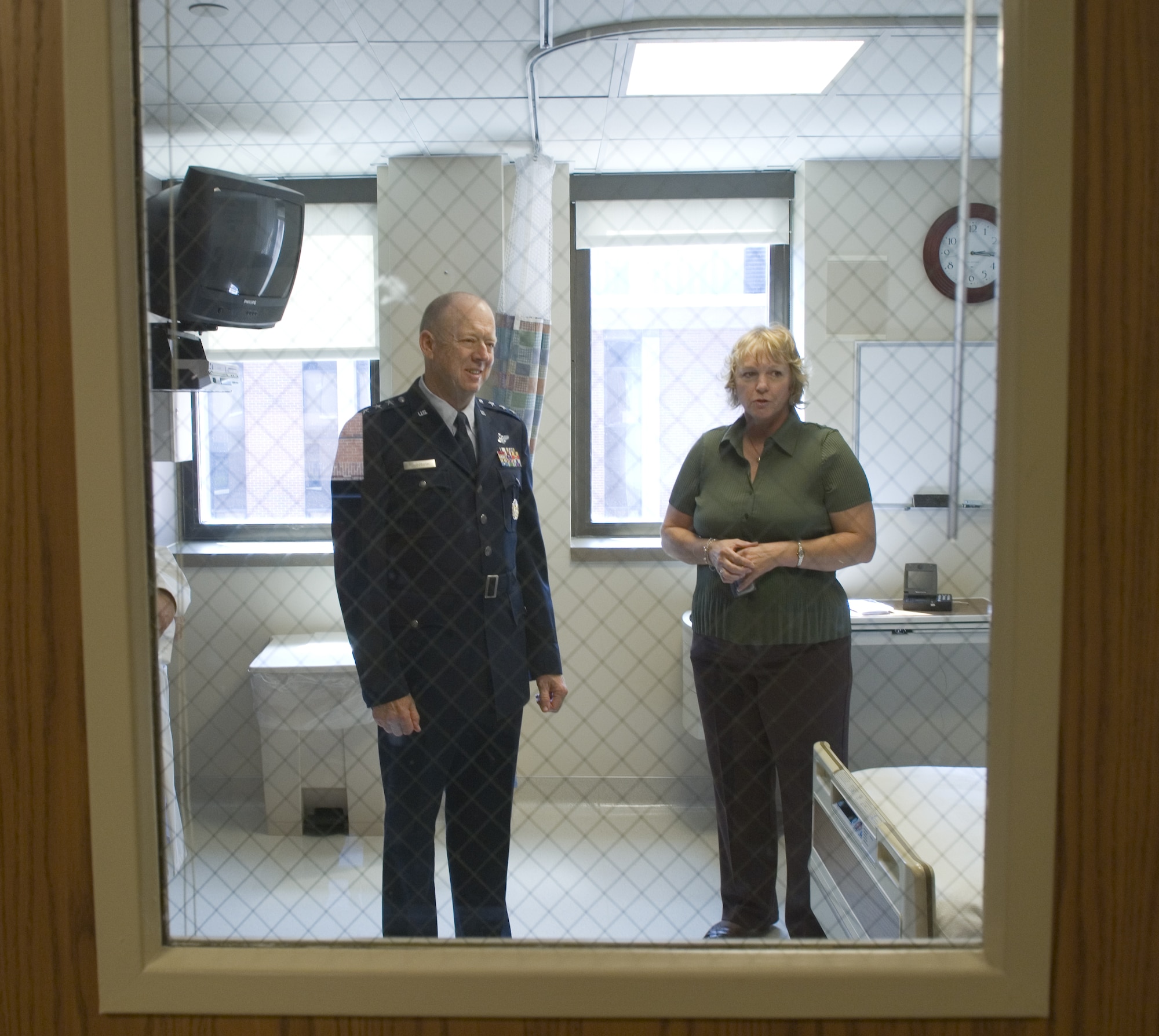 Kate Boulter  explains to Lt. Gen. (Dr.) James G. Roudebush the many unique features of a patient room in the only civilian biocontainment unit in the nation Aug. 13 in Omaha, Neb. This is a specialized 10-bed area in the University of Nebraska Medical Center College of Medicine. General Roudebush also toured the new Sorrell Center of his alma mater. The general is a native Nebraskan and the Air Force surgeon general. Ms. Boulter is a registered nurse at the hospital. (U.S. Air Force photo/Lance Cheung)