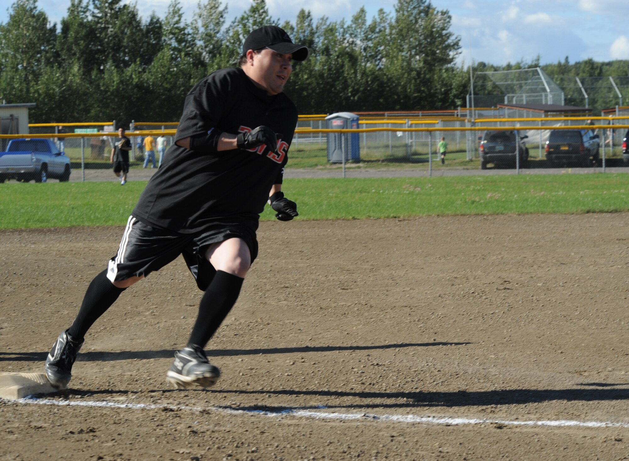 ELMENDORF AIR FORCE BASE, Alaska -- Matt Saiz, a member of the 381st Intelligence Squadron softball team, heads for home during the game August 6. The 381st IS went head to head with the 19th Fighter Squadron Gamecocks in a bid for the Intramural Softball Championship game. The 381st IS won the championship game finishing the season with a record of 10-1. (U.S. Air Force photo/Airman 1st Class Matthew Owens)