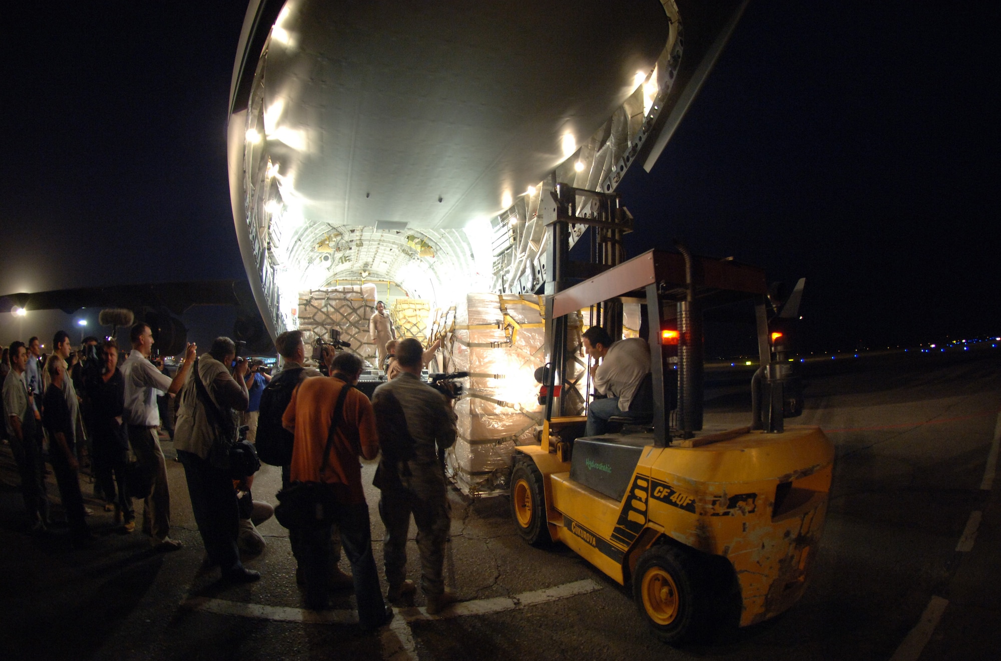 International press photograph the first of 16 pallets containing $1 million in humanitarian aid to the Republic of Georgia. The delivery was a joint-service effort between U.S Army Europe Soldiers and Airmen representing U.S. Air Forces in Europe and Air Mobility Command. (U.S. Air Force photo/Master Sgt. Scott Wagers) 