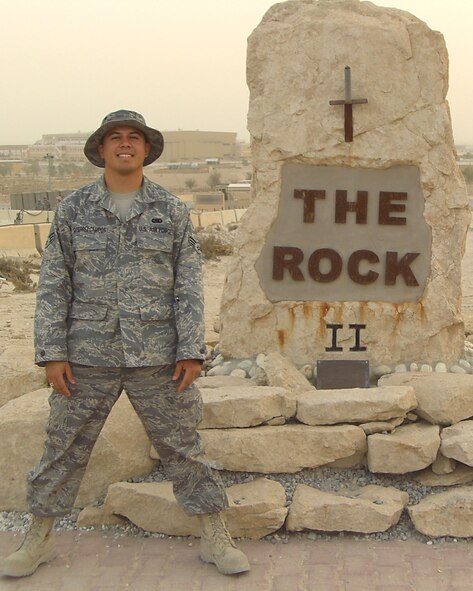 SOUTHWEST ASIA — Senior Airman Jose Gutierrez Campos, 62nd Logistics Readiness Squadron, poses in front of a base monument during a recent deployment. Airman Campos is the material management section chief with the 386th Air Expeditionary Wing. He aids in support of the 387th Air Expeditionary Group’s mission by monitoring vital reports daily, maintaining control of the vehicle fleet, managing the drinkable water in support of Airmen and transient personnel and conducting research and procuring mission essential assets. (Courtesy photo.)