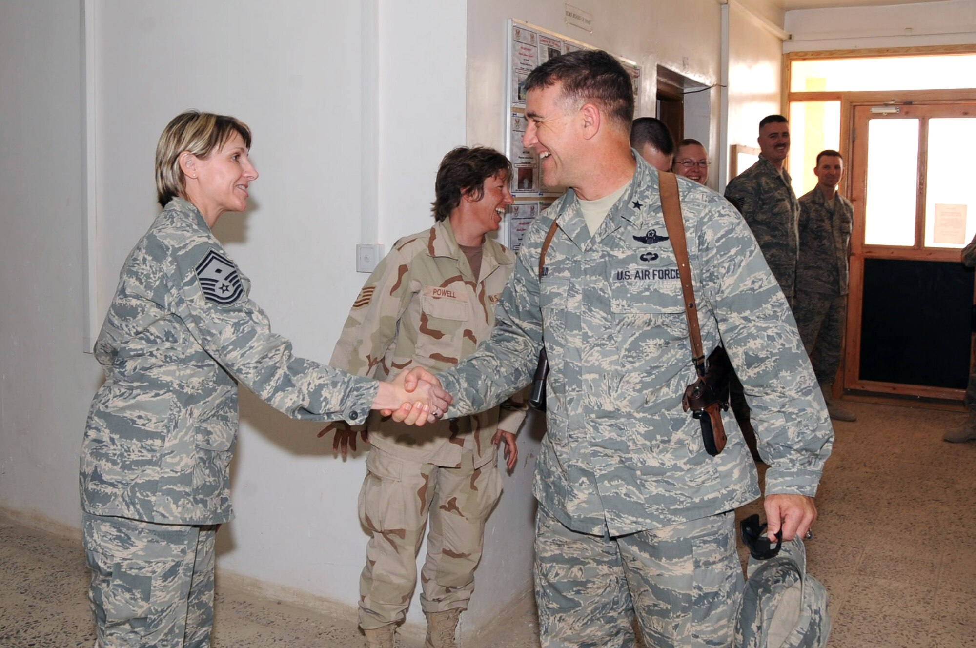 IRAQ – Senior Master Sgt. Annette Sisseck, 62nd Aerial Port Squadron first sergeant, greets Gen. Burton Field, the 332nd Air Expeditionary Wing commander during a recent deployment. (Courtesy photo.)