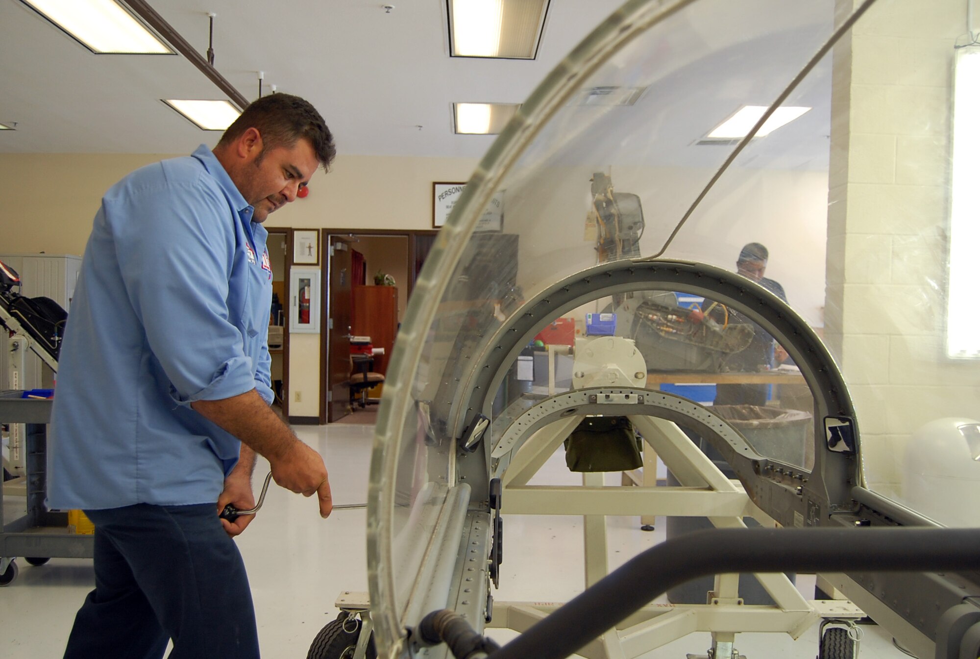 LAUGHLIN AIR FORCE BASE, Texas-- Hector Hernandez, 47th Maintenance Directorate, repairs the canopy of a T-38 Talon at the egress shop here Aug. 8.  Members of the Aircraft Ordnance Systems shop, commonly referred to as egress technicians, are responsible for performing inspections on the T-6s and T-38s ejection seats. They are also responsible for maintaining complete emergency escape systems, such as ejection seats, escape hatches and capsules used by flight personnel to escape disabled aircraft.  (U.S. Air Force photo/Staff Sgt. Olufemi A. Owolabi)