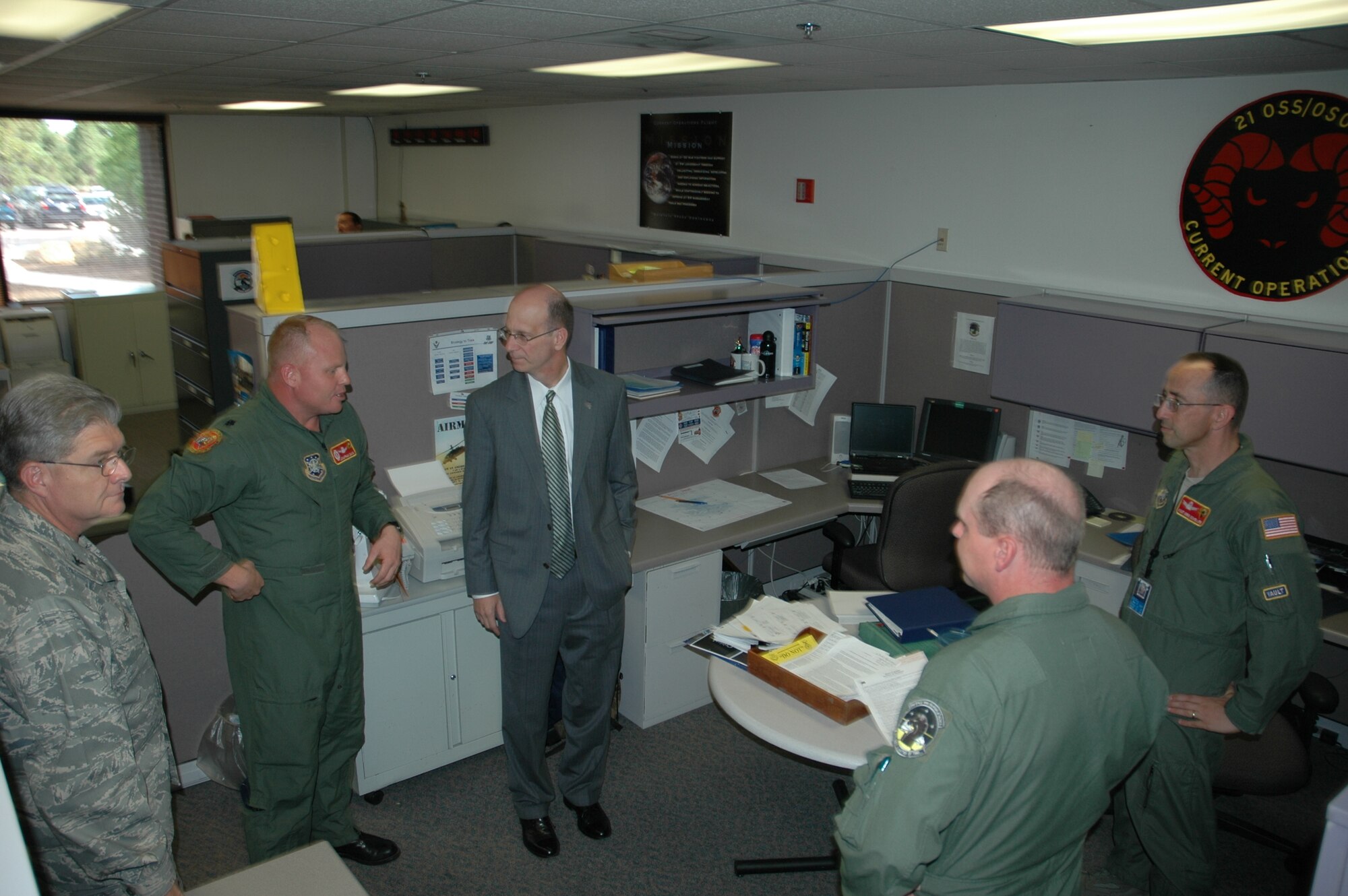 Mark Doboga, Airmen’s Time Assessment Team leader, speaks with members of the 21st Operations Support Squadron while touring that unit Aug. 11 at Peterson Air Force Base, Colo. Mr. Doboga and the Headquarters, Air Force team, are visiting several Air Force installations throughout the globe as they address concerns from commanders on what challenges they face concerning additional workloads and their programs. Mr. Doboga is a member of the Senior Executive Staff and is the director of Plans and Integration and the Air Force Personnel Operations Agency, as well as the Air Force’s Manpower and Personnel deputy chief of staff. (U.S. Air Force photo/Senior Airman Stephen Collier)