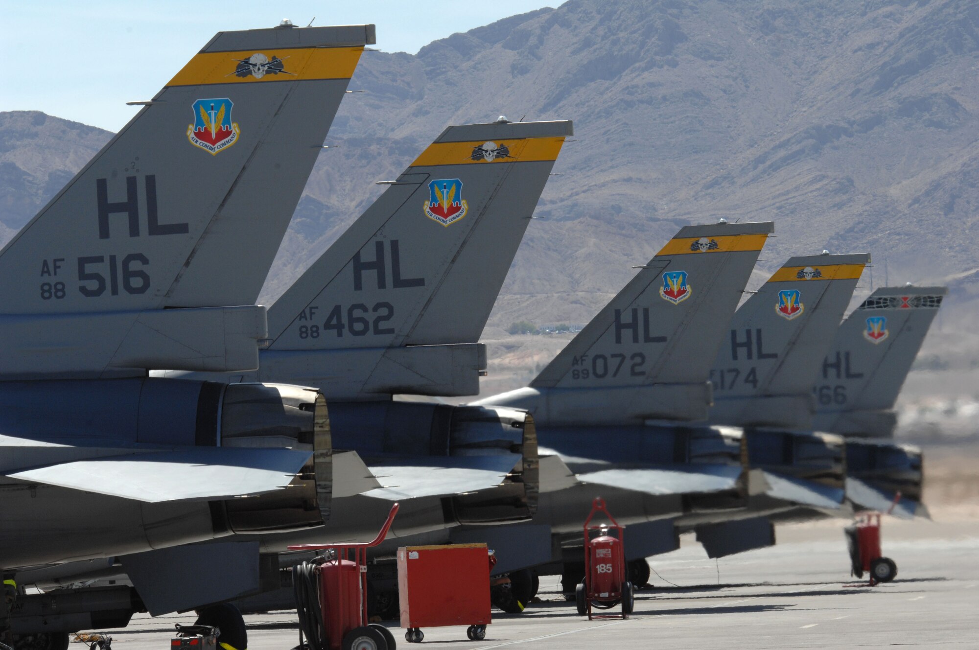 F-16s from Hill Air Force Base, Utah, line the runway at Nellis Air Force Base, Nev., in preparation for the Red Flag exercise taking palce this month. (U.S. Air Force photo)