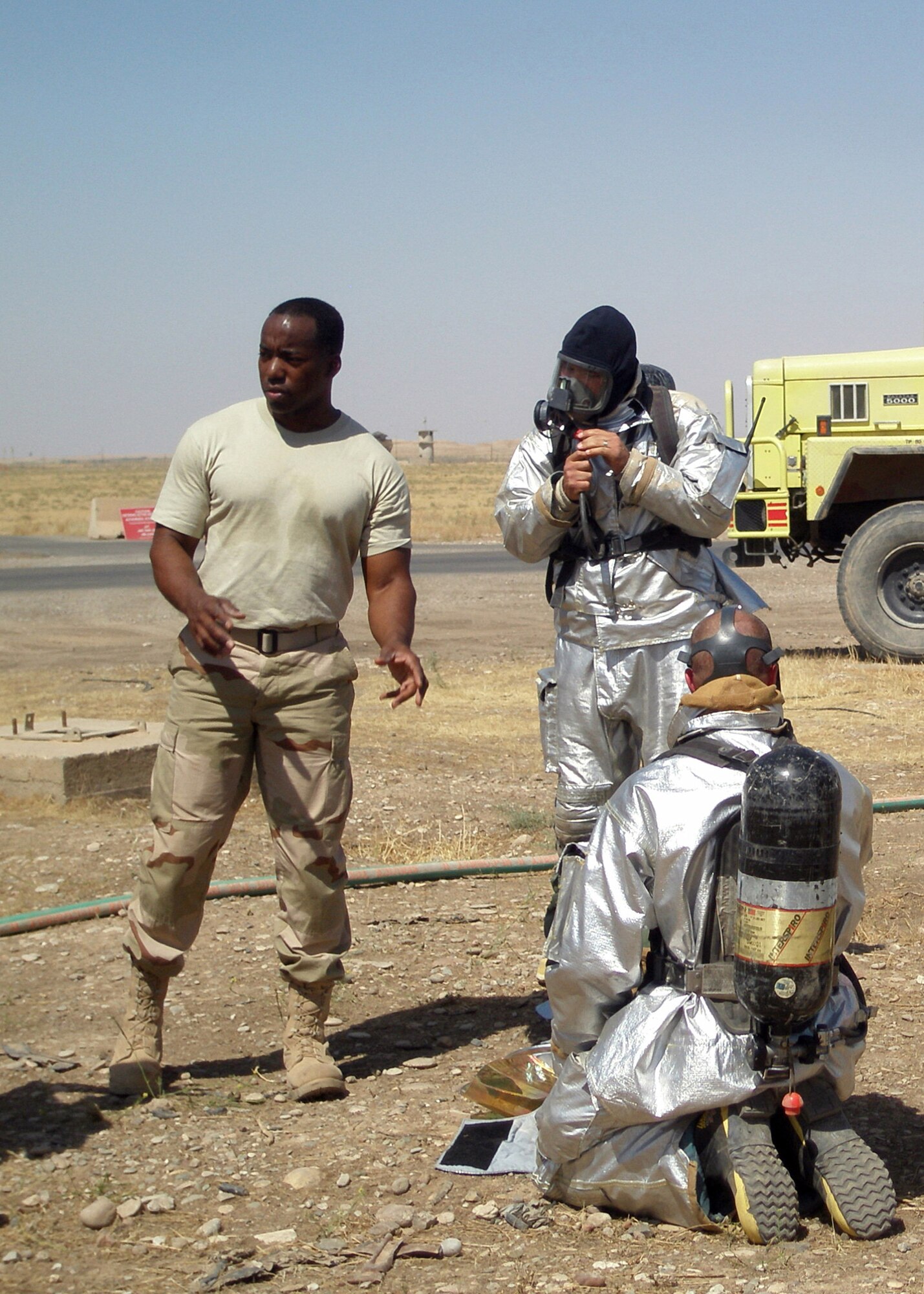 Master Sgt. Jimmy Mobley, assistant chief of training with the 506th Expeditionary Civil Engineer Squadron, instructs crews on safety concerns during a live-fire exercise at an underground bunker on Kirkuk Air Base, Iraq, June 11, 2008. The training was scheduled for firefighters to experience the effects of fighting basement fires. Sergeant Mobley, a Monroe, La., native and traditional reservist, is deployed here from Barksdale Air Force Base, La. (U.S. Air Force photo/Master Sgt. Linda Thompson)