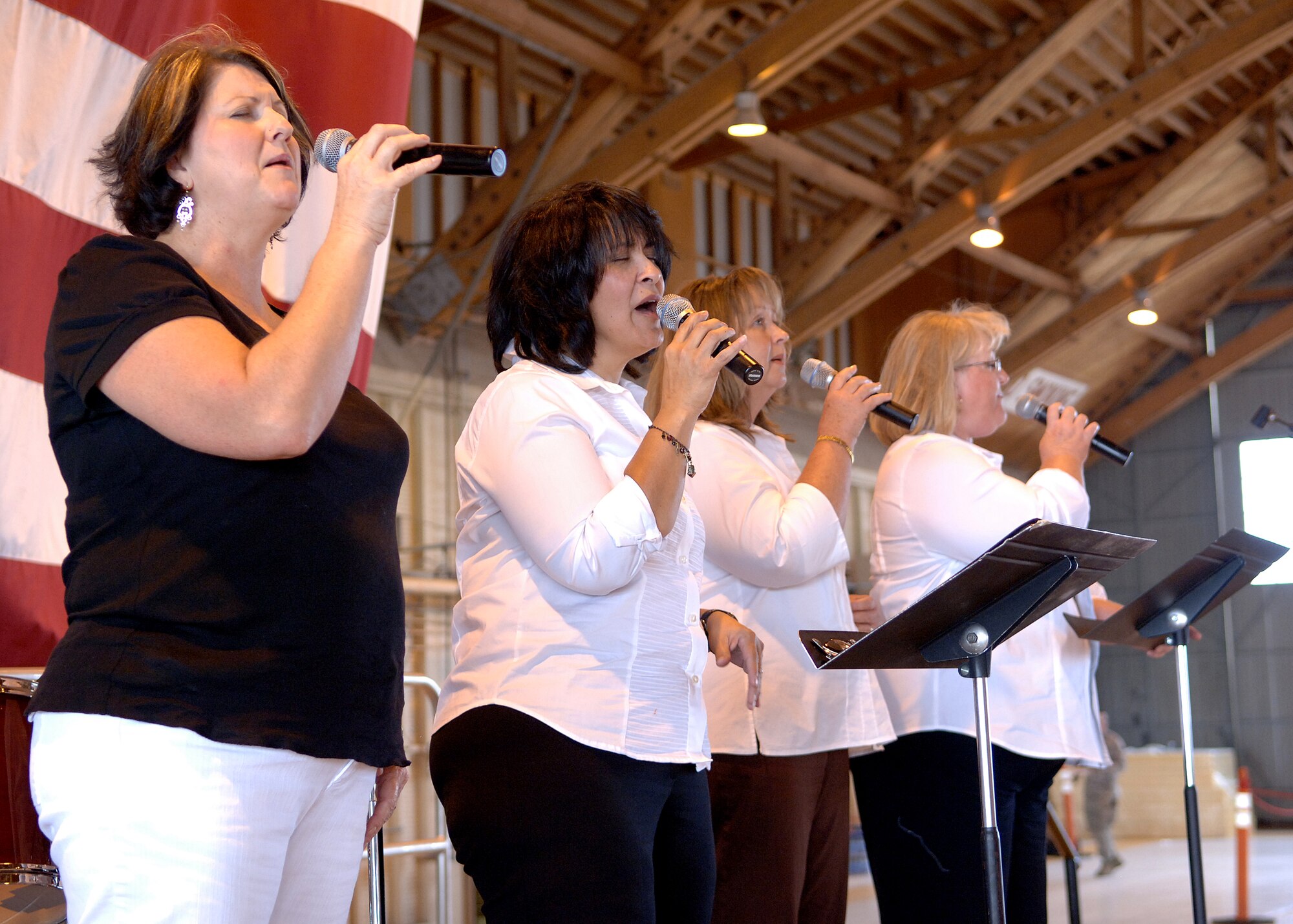 The gospel singing group, Hand Maidens, performs at the wing Hail and Farewell, Aug. 7, at Holloman Air Force Base, N.M.  (U.S. Air Force photo/Airman 1st Class John D. Strong II)