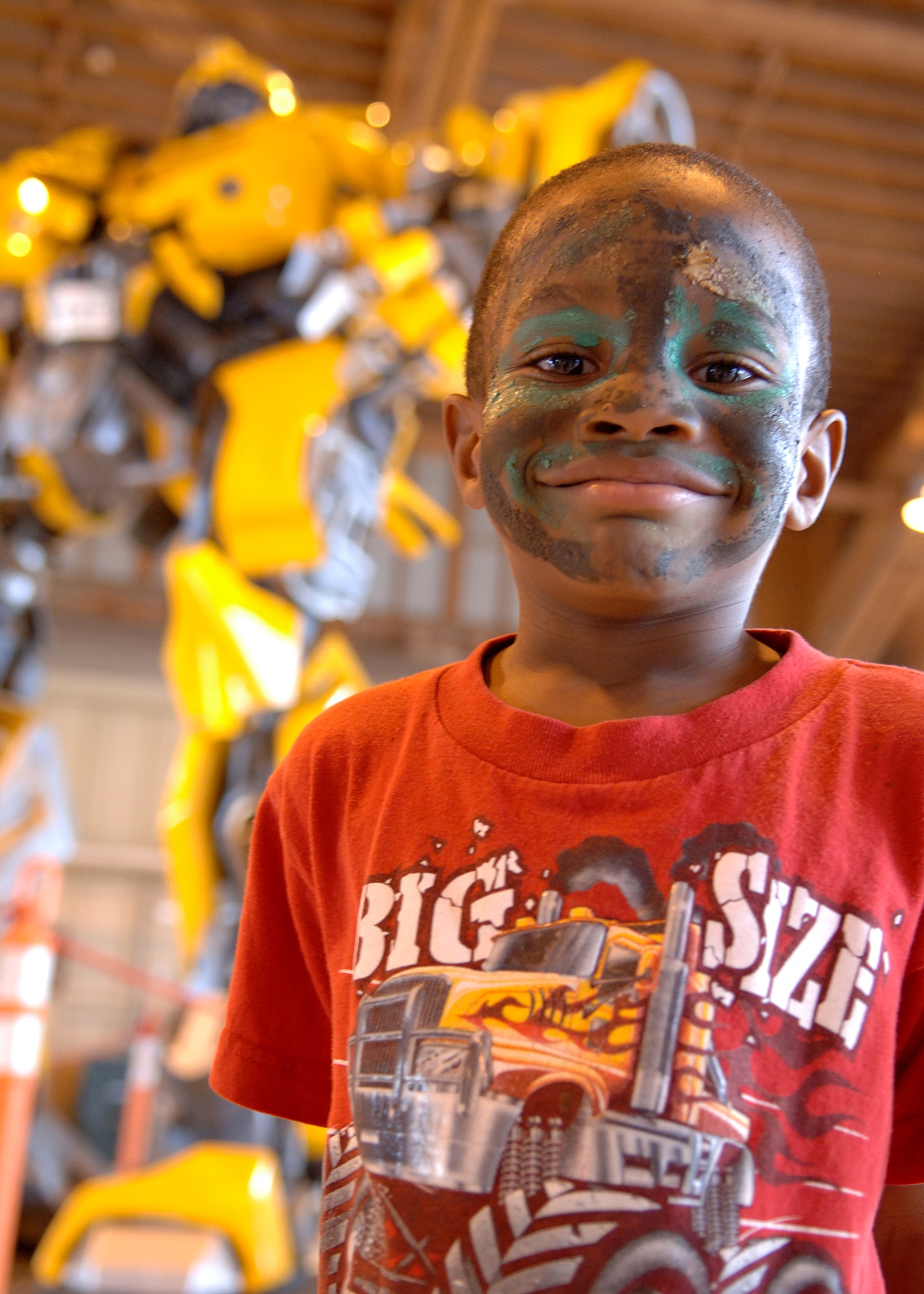 Tyrone Haskins Jr.,5, son of Tech. Sgt. Tynisa Haskins, 49th Fighter Wing Staff Judge Advocate office, smiles after seeing his favorite transformer Bumblebee, at the wing Hail and Farewell Aug. 7, at Holloman Air Force Base, N.M.  (U.S. Air Force photo/Airman 1st Class John D. Strong II)