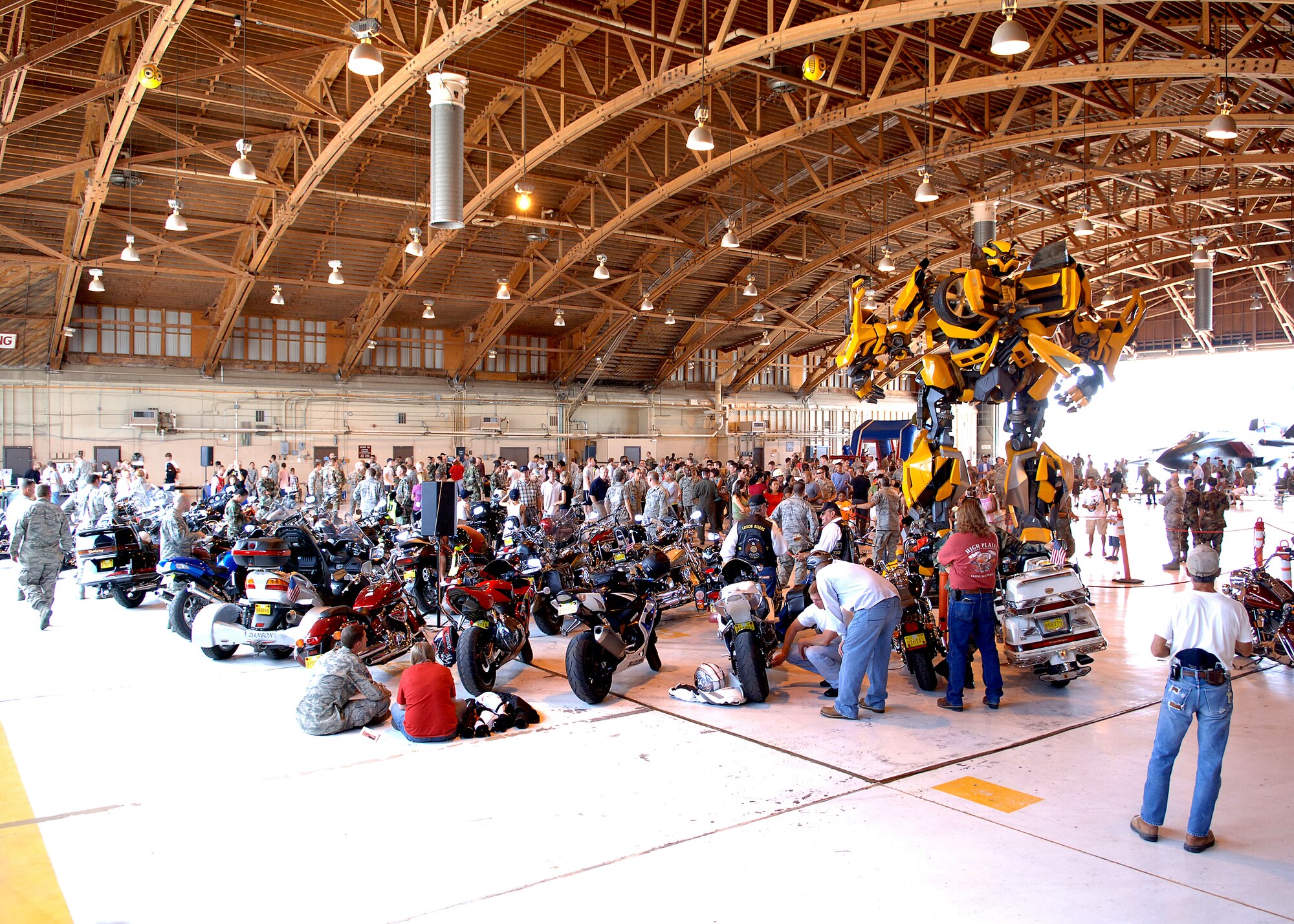 Members of Team Holloman gather in Hangar 301 for food, fun and entertainment at the wing Hail and Farewell Aug. 7 at Holloman Air Force Base, N.M.  (U.S. Air Force photo/Airman 1st Class John D. Strong II)  