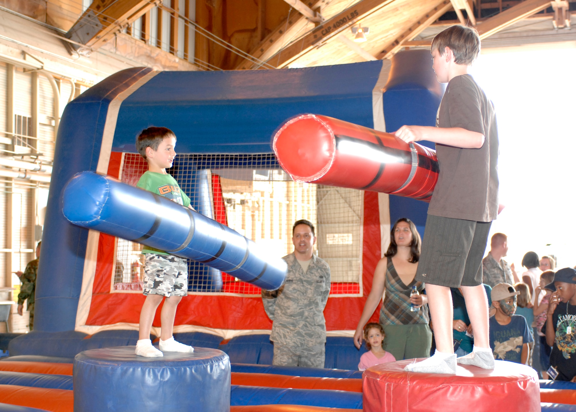 Conner, 4, and Samuel Flahive, 11, jaust in the American Gladiator pit, Aug. 7 at the Hail and Farewell in Hangar 301 at Holloman Air Force Base, N.M. (U.S. Air Force photo/Airman 1st Class Rachel A. Kocin)