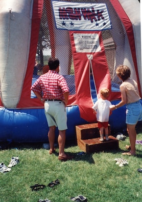 A young family member steps up to an inflatable bouncer during one of the 931st Air Refueling Group's past Family Day picnics.  Volunteers are needed to help with an inflatable "Bounce House" and many other activities scheduled for this year's picnic during the September Unit Training Assembly.