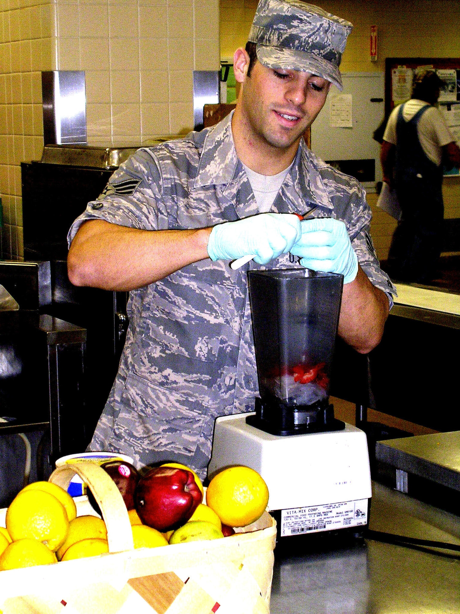 Senior Airman Kevin Siclari of the Nutritional Medicine Flight prepares a “combat shake.” His smoothie recipes nourished patients and troops overseas and are now a staple in the Wright-Patterson Medical Center kitchen.  (U.S. Air Force photo)