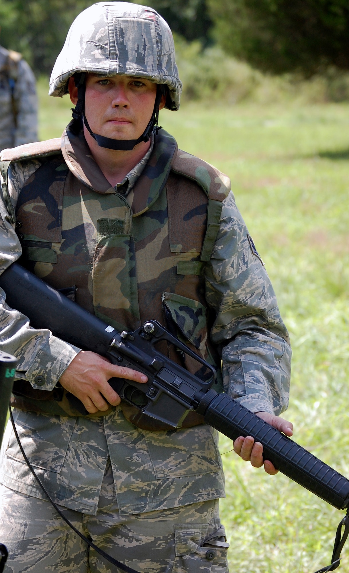 Senior Airman Roger Rhymer, chaplain assistant from the 20th Fighter Wing Chapel, Shaw Air Force Base, S.C., waits for his next order from his contingency skills training instructor during a patrolling and tactics class in the Air Force Advanced Contingency Skills Training Course Aug. 12, 2008, on a Fort Dix, N.J., range.  ACST is taught by the U.S. Air Force Expeditionary Center's 421st Combat Training Squadron.  (U.S. Air Force Photo/Tech. Sgt. Scott T. Sturkol)