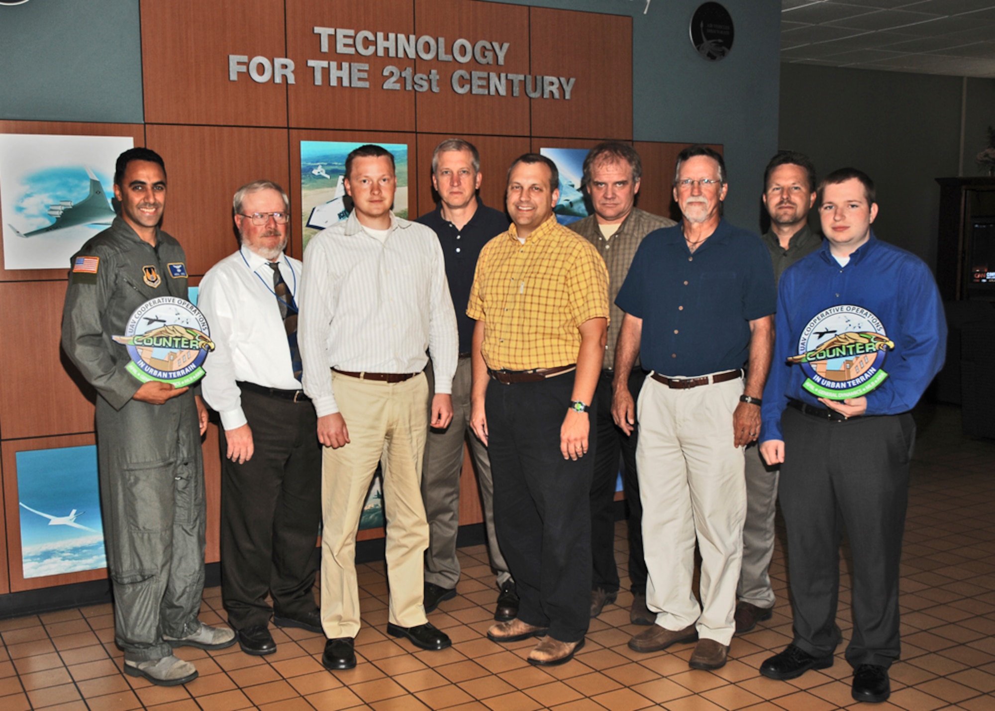 The award-winning COUNTER team.  Front row, left to right:  Major Nidal Jodeh, Phillip Chandler, Raymond Holsapple, Dave Gross, Jeff Hill, Jason Davis.  Back row, left to right:  Gregory Feitshans, Steve Rasmussen, Allen Rowe.  (AFRL photo by Multimedia)