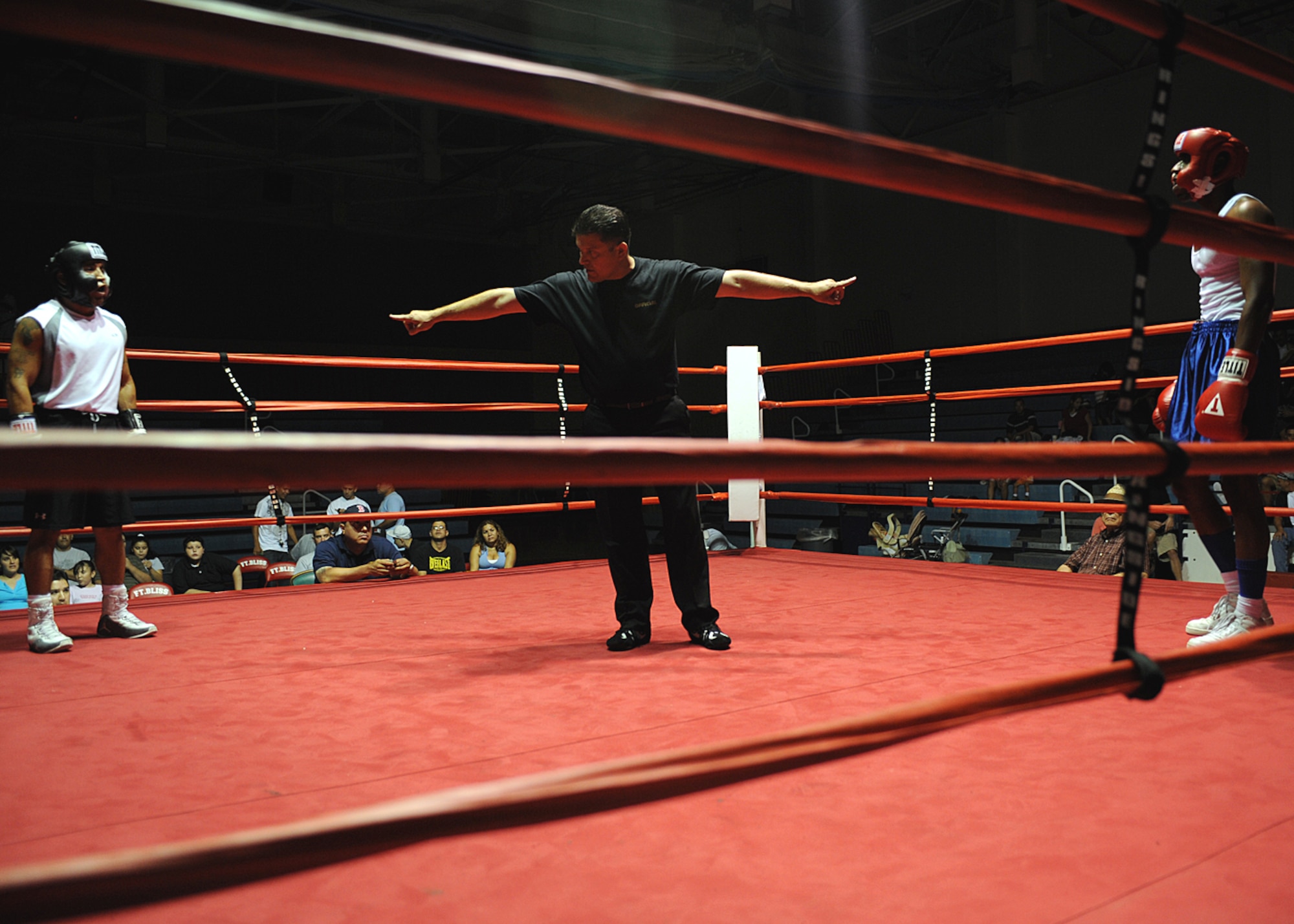 2nd Lt Brandon Sanders, 49th Civil Engineer Squadron, waits for the bell to ring before his boxing match with Army Staff Sgt. Hector Dozal at the Border Rumble at Fort Bliss Army Post in El Paso, Texas, July 25. (U.S Air Force photo/ Airman 1st Class DeAndre Curtiss) 