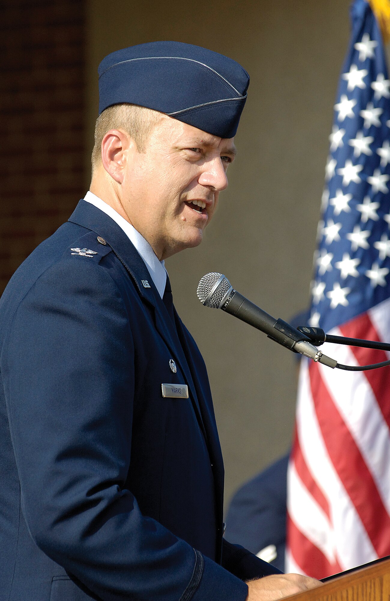 Col. Robert Marks addresses 72nd Medical Group Airmen shortly after assuming command of the group during an Aug. 5 ceremony in front of the facility. (Air Force photo/Margo Wright)