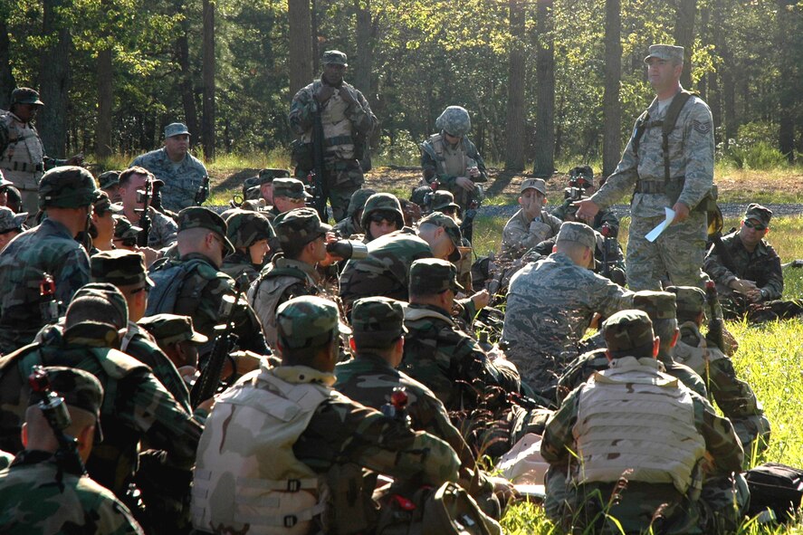 Tech. Sgt. William Lipsett, 421st Combat Training Squadron, talks to students in the Advanced Contingency Skills Training Course about basic combat patrolling and tactics on a range on Fort Dix, N.J., Aug. 12, 2008.  The course, taught by the U.S. Air Force Expeditionary Center's 421st CTS, prepares Airmen for upcoming deployments.  (U.S. Air Force Photo/Staff Sgt. Paul R. Evans)