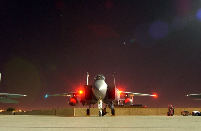 An F-15K Slam Eagle from the Republic of Korea sits on the Nellis Air Force Base parking ramp receives a preflight inspection before night launches begin, Aug. 11, 2008.  ROKAF aircraft and crews are participating in their first Red Flag exercise. Red Flag provides a peacetime "battlefield" within which U.S. and allied aircrews train to fight, survive and win. (U.S. Air Force photo by: Airman 1st Class Ryan Whitney)                                           