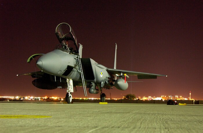 An F-15K Slam Eagle from the Republic of Korea sits on the Nellis Air Force Base parking ramp awaiting preflight maintenance before night launches begin, Aug. 11, 2008.  ROKAF aircraft and crews are participating in their first Red Flag exercise. Red Flag provides a peacetime "battlefield" within which U.S. and allied aircrews train to fight, survive and win. (U.S. Air Force photo by: Airman 1st Class Ryan Whitney)                              