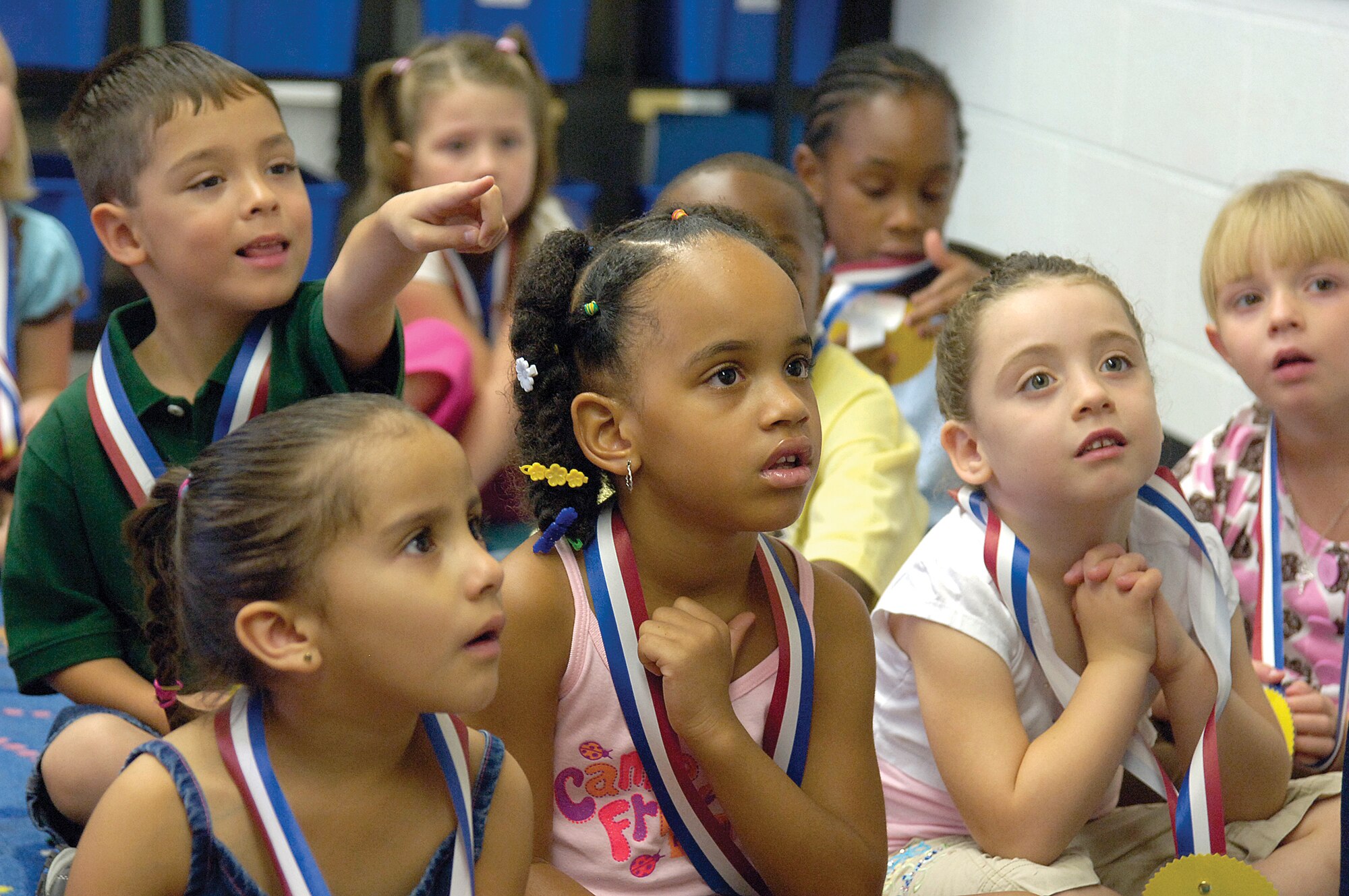 Tinker Elementary School kindergarteners are absorbed in a book about the first day of school, read to them by teacher Jaime Tucker.(Air Force photo/Margo Wright)