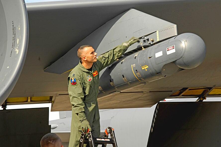 MINOT AIR FORCE BASE, N.D. -- Capt. James Dailey, 23rd Bomb Squadron weapons and tactics flight commander, checks to make sure the new Litening AT laser targeting pods is secure before take-off here Aug. 9 in preparation for a training mission at the Smokey Hill Training Range near Salina, Kan. The Litening Pod is a laser targeting system that significantly improves the mission readiness of the B-52. (U.S. Air Force photo by Senior Airman Joe Rivera)