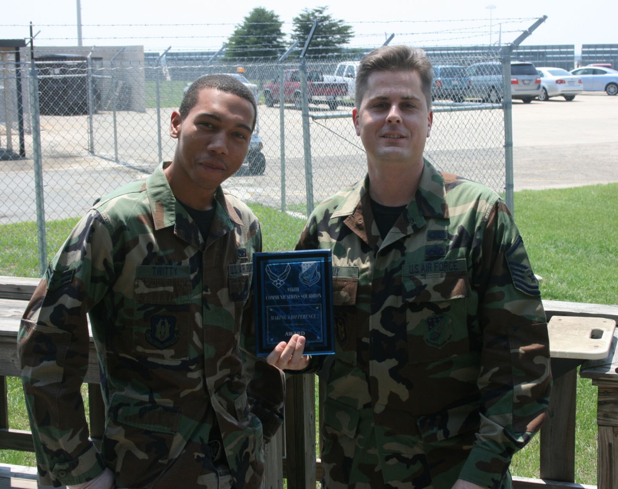 SEYMOUR JOHNSON AIR FORCE BASE, N.C. -- Airman First Class Christopher Twitty (left) and Master Sgt. David Guy received the Making a Difference Award during the August unit training assembly for their 'above and beyond' performance with the 916th Communication Squadron.