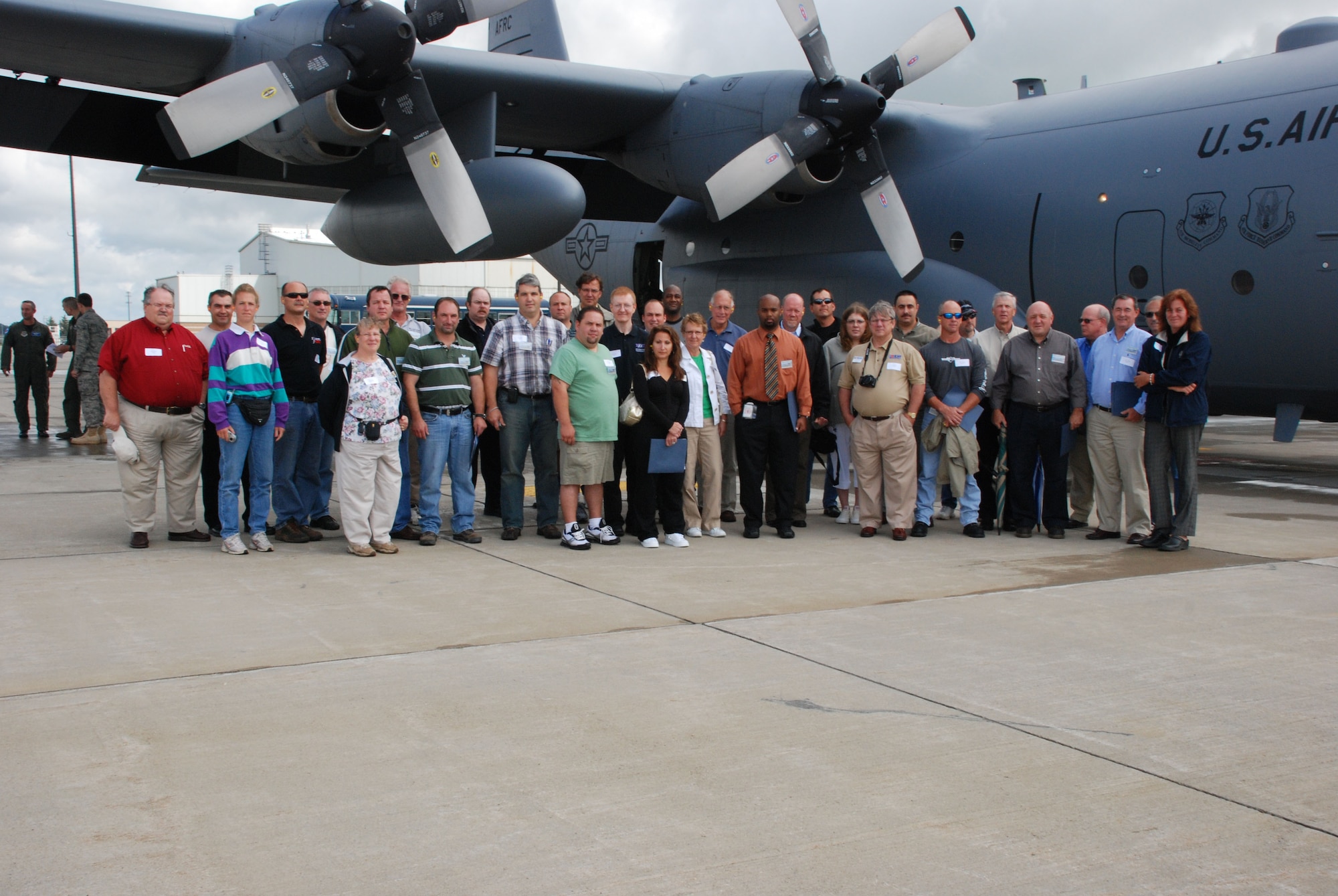 The moment will be forever etched in digital history for a group of local employers, prior to their flight of a life time the group gathered for a photo. Guardsman?s and reservist?s bosses had the opportunity to visit the Niagara Falls Air Reserve Station on the first joint 107th and 914th Bosses? Day held on Aug. 8. (Air Force Photo/ Master Sgt. Paul Brundage)