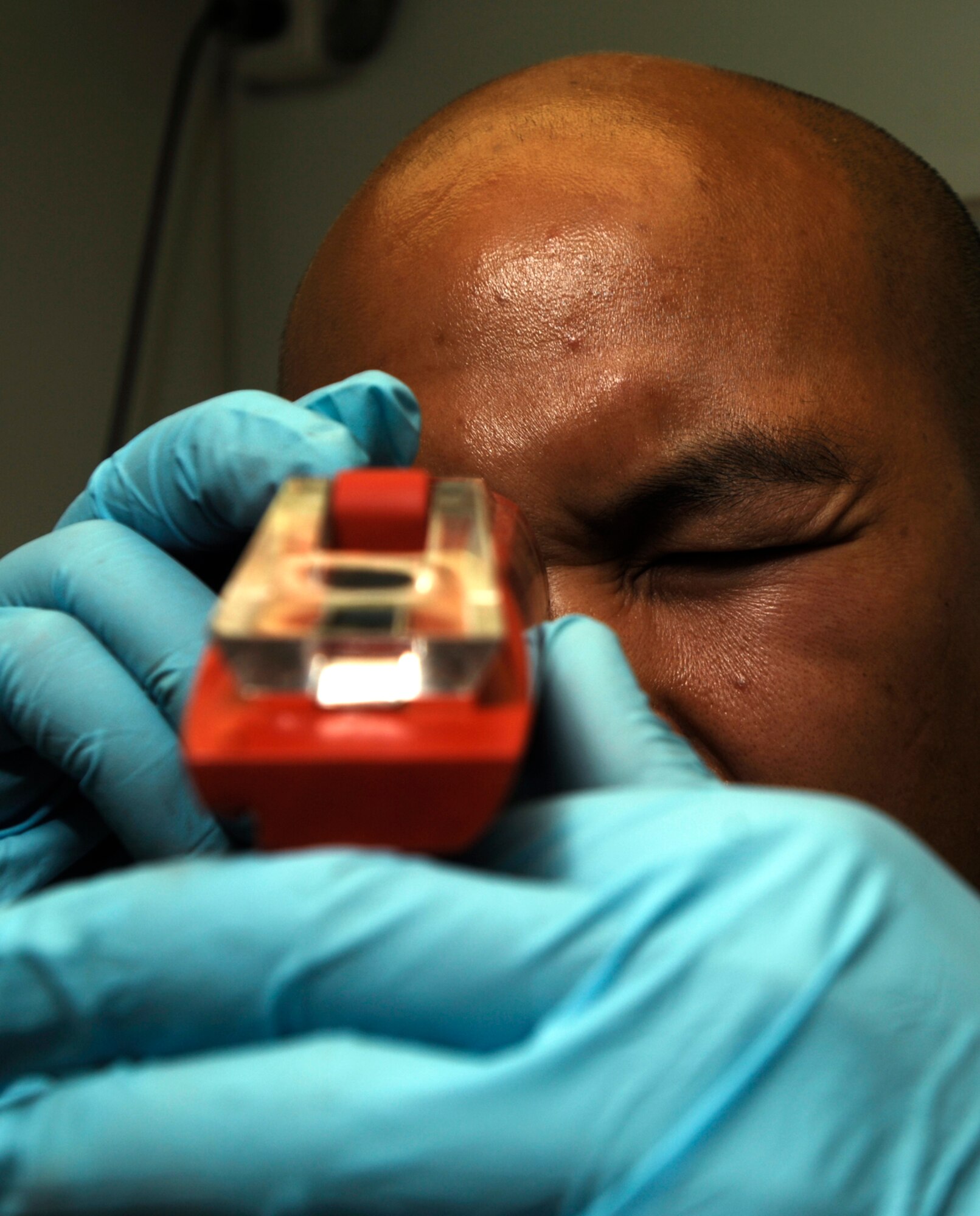 JOINT BASE BALAD, Iraq -- Staff Sgt. Benjamin Laguana checks for fuel system inhibitors with a refractometer here Aug. 12. The fuel is checked regularly to ensure no contaminants are present. Sergeant Laguana, a fuels laboratory technician with the 332nd Expeditionary Logistics Readiness Squadron here, is deployed from Holloman Air Force Base, N.M. His hometown is Long Beach, Calif. (U.S. Air Force photo/Airman 1st Class Jason Epley)
