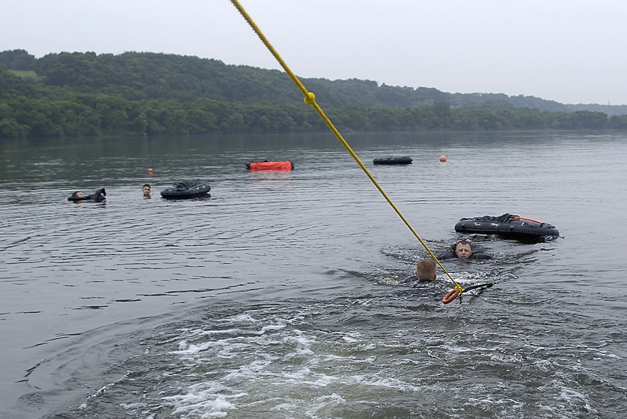 MISAWA AIR BASE, Japan -- Staff Sgt. Benjamin Thomas, 35th OSS SERE Specialist and Capt Brent Ritzke, 14th FS, simulate a parachute drag while being pulled by a boat conducting water survival training July 23, 2008.  Water survival training is designed to reacquaint aircrew members with survival procedures and techniques.  (U.S. Air Force photo by Senior Airman Chad Strohmeyer)