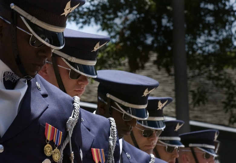 Air Force Honor Guard drill team members perform Aug. 12 for visitors of the Henry Doorly Zoo in Omaha, Neb. Zoo visitors also had the chance to see the Do Something Amazing display featuring an F-16 Fighting Falcon, a motion simulator and video simulators during Air Force Week in the Heartland. (U.S. Air Force photo/Lance Cheung)