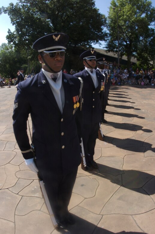 Air Force Honor Guard drill team members perform Aug. 12 for visitors of the Henry Doorly Zoo in Omaha, Neb. Zoo visitors also had the chance to see the Do Something Amazing display featuring an F-16 Fighting Falcon, a motion simulator and video simulators during Air Force Week in the Heartland. (U.S. Air Force photo/Lance Cheung)