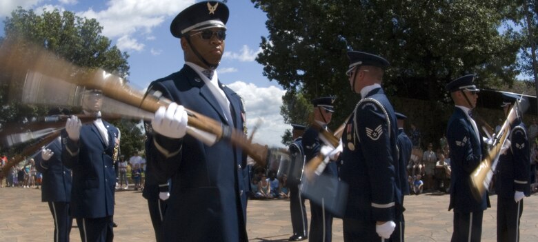 Air Force Honor Guard drill team members perform Aug. 12 for visitors of the Henry Doorly Zoo in Omaha, Neb. Zoo visitors also had the chance to see the Do Something Amazing display featuring an F-16 Fighting Falcon, a motion simulator and video simulators during Air Force Week in the Heartland. (U.S. Air Force photo/Lance Cheung)