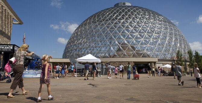 Henry Doorly Zoo visitors see Air Force displays during Air Force Week in the Heartland Aug. 12 in Omaha, Neb. Zoo vis itors had the chance to see the Do Something Amazing display, a motion simulator and video simulators during Air Force Week in the Heartland. (U.S. Air Force photo/Lance Cheung)