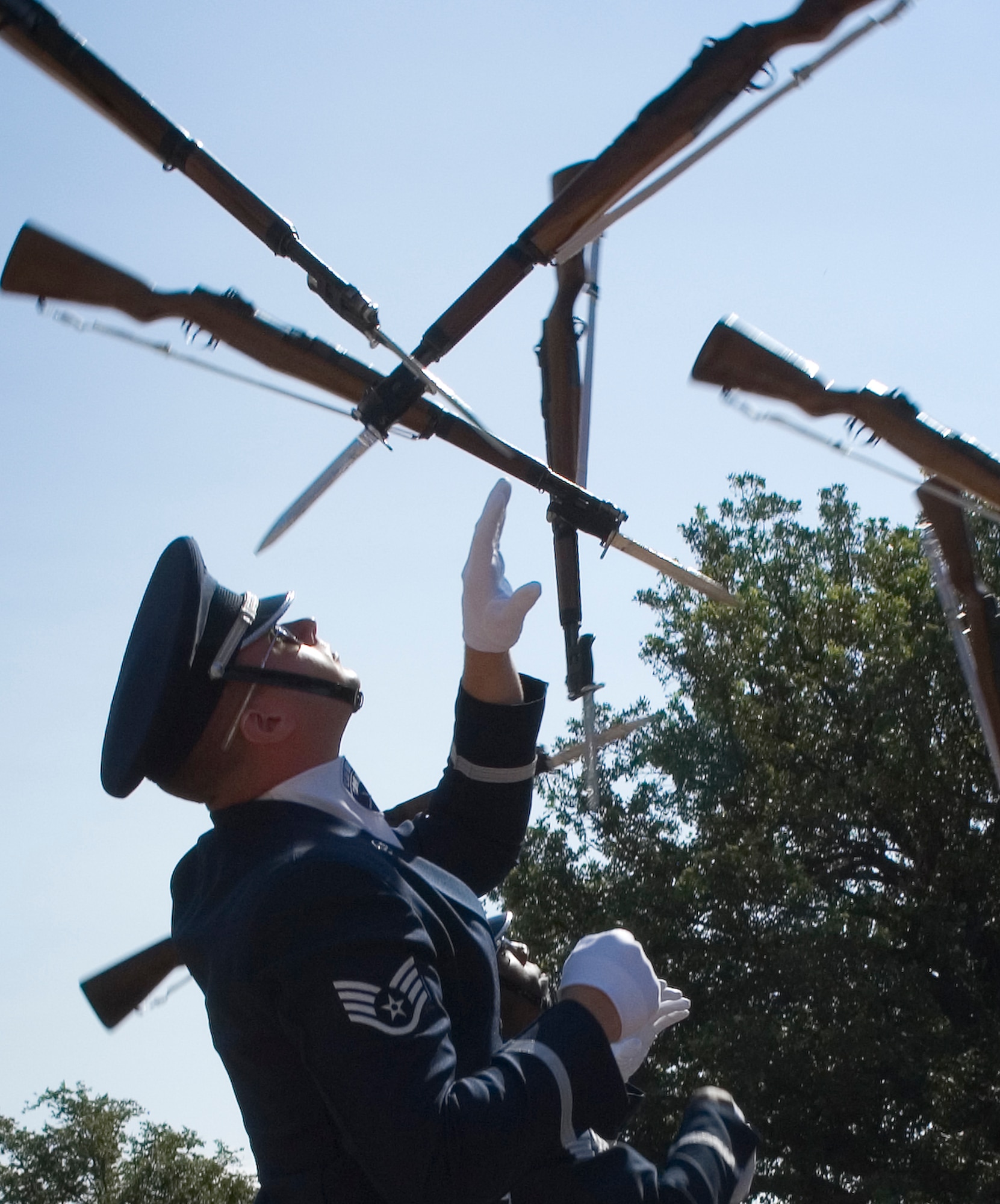 Air Force Honor Guard drill team members perform Aug. 12 for visitors of the Henry Doorly Zoo in Omaha, Neb. Zoo visitors also had the chance to see the Do Something Amazing display featuring an F-16 Fighting Falcon, a motion simulator and video simulators during Air Force Week in the Heartland. (U.S. Air Force photo/Lance Cheung)