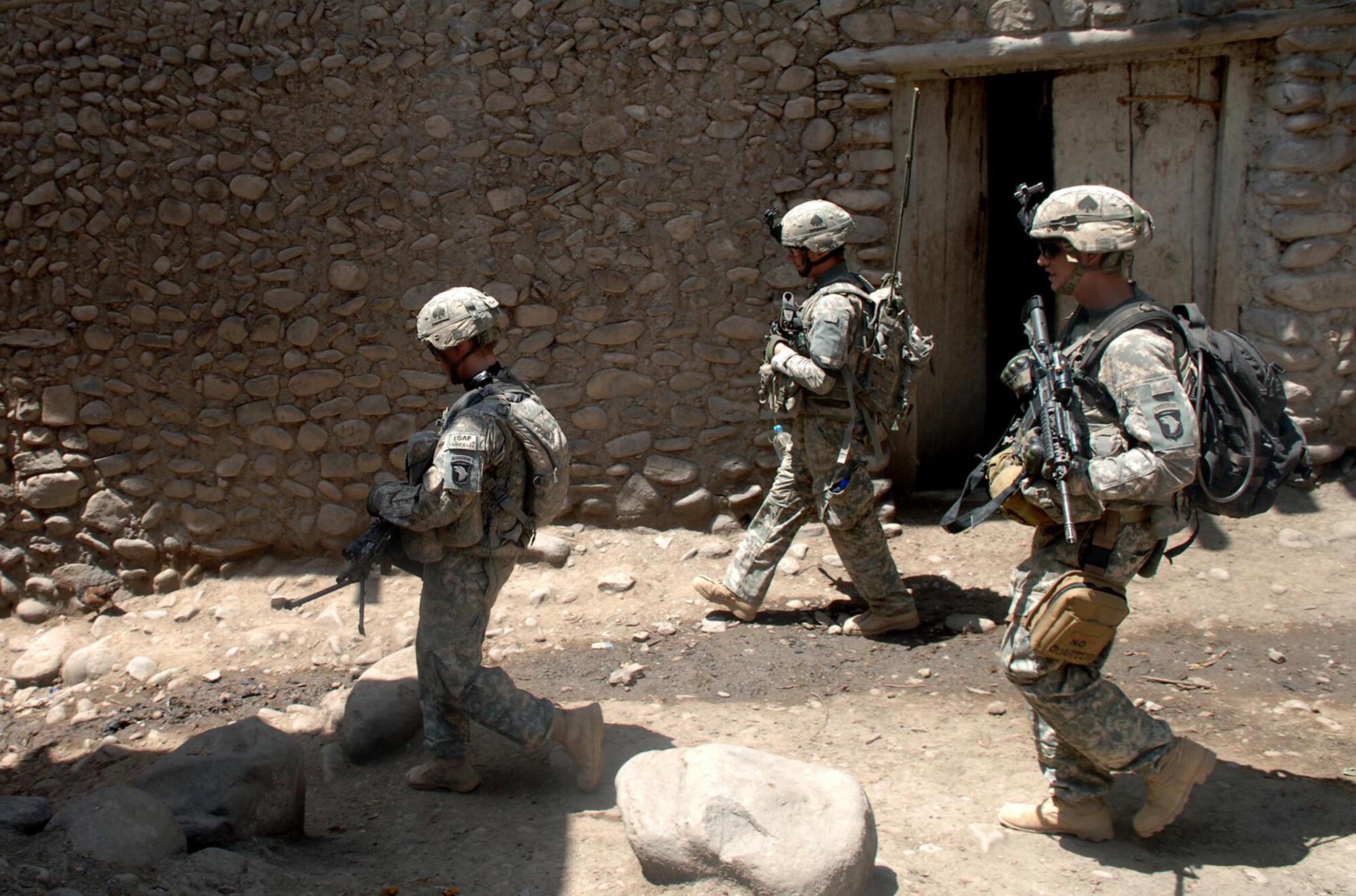 Soldiers from 3rd Platoon, Company A, 2nd Battalion, 506th Infantry Regiment, patrol a village in an attempt to befriend the local population in Zirok, Afghanistan. (U.S. Army Photo by Spc. Casey Ware)