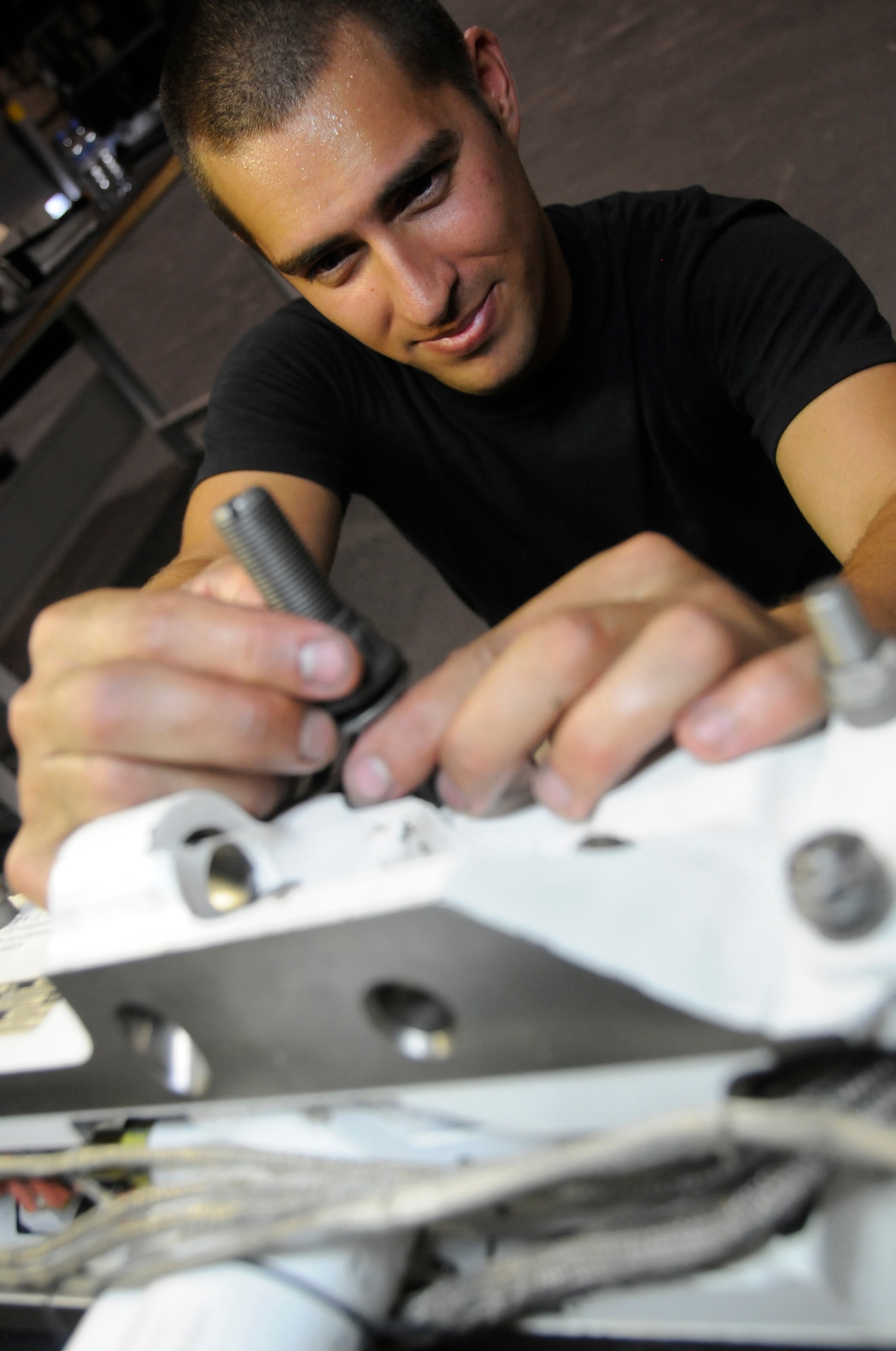 Staff Sergeant Christopher Ospina, armament team chief with the 379th Expeditionary Maintenance Squadron, performs a 24-month inspection of a BRU-56 inch rack Aug. 12, 2008, at an undisclosed air base in Southwest Asia. The 379th Expeditionary Maintenance Squadron is responsible for maintaining aircraft to ensure they can complete their missions throughout the US Central Command’s area of responsibility. Sergeant Ospina, a native of Savannah, Ga., is deployed from Ellsworth Air Force Base, S.D., in support of Operations Iraqi Freedom, Enduring Freedom and Joint Task Force-Horn of Africa. (U.S. Air Force photo by Staff Sgt. Darnell T. Cannady/Released)