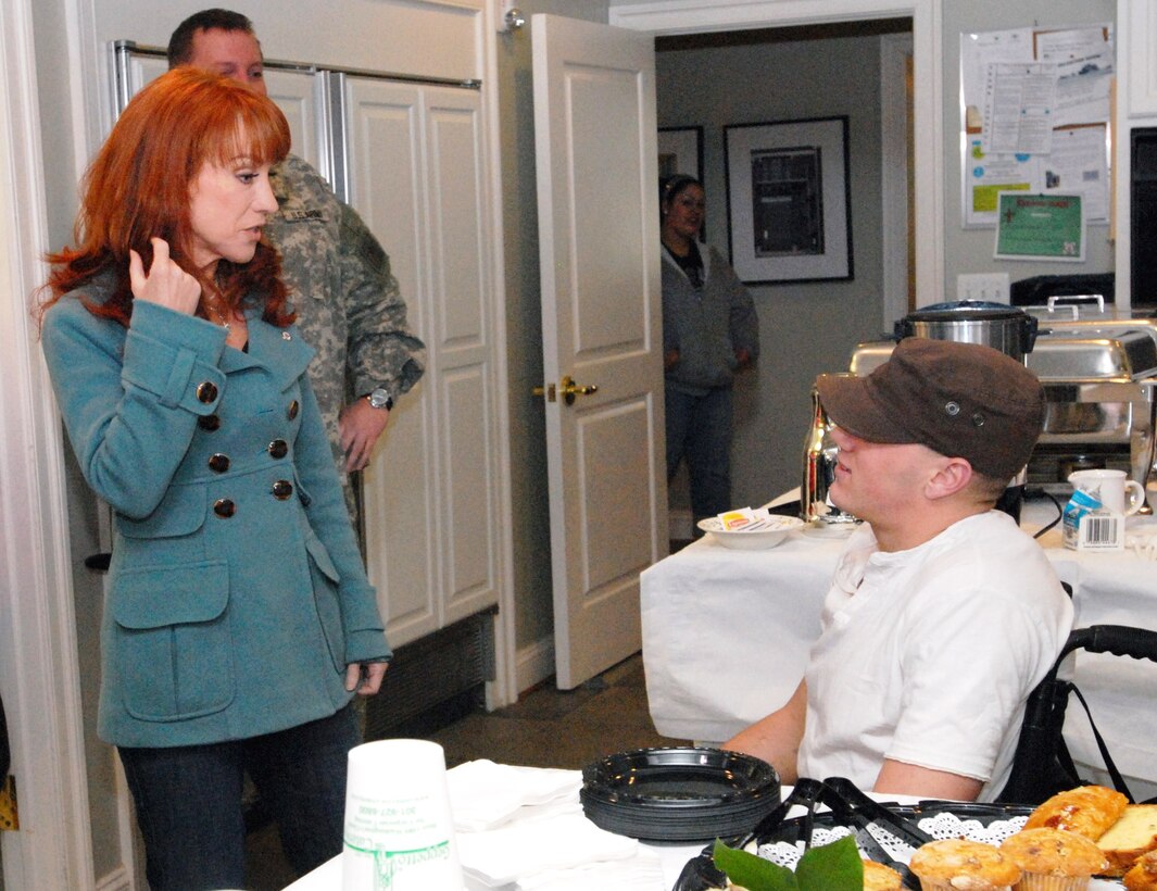 Comedian Kathy Griffin, star of "My Life on the D List," talks with Army Cpl. Joseph McCauley on April 3, 2008. McCauley is at Walter Reed Army Medical Center recovering from a traumatic brain injury he suffered March 23 while serving in Iraq. Griffin visited troops and their families in both the Fisher Houses and the hospital before performing a show for the troops in the evening. Defense Dept. photo by Samantha L. Quigley