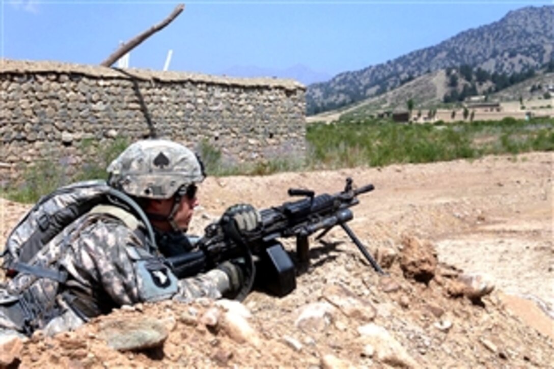 A U.S Army soldier pulls guard while on patrol in the village of Zirok, Afghanistan, July 31, 2008. The soldier is assigned to Company A, 2nd Battalion, 506th Infantry Regiment. 