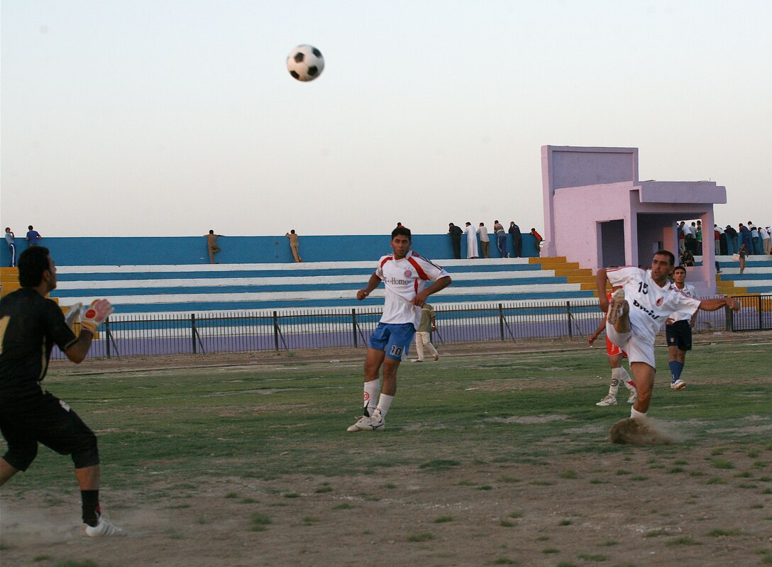 RAMADI, Iraq (August 13, 2008) - Iraqi’s play a game of soccer during the Ramadi Soccer Tournament at the Mulaab Soccer Stadium August 10. The tournament involved 10 teams from various neighborhoods in the city. The event was featured two elimination-style games played each night until a winner was determined. (Official U.S. Marine Corps photo by Staff Sgt. Joshua S. Higgins) (RELEASED)