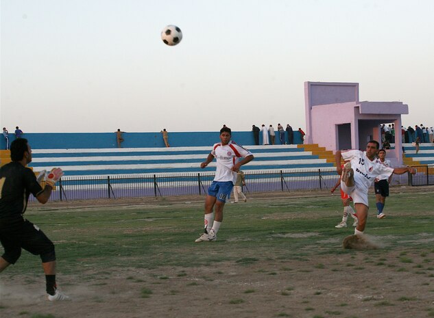 RAMADI, Iraq (August 13, 2008) - Iraqi’s play a game of soccer during the Ramadi Soccer Tournament at the Mulaab Soccer Stadium August 10. The tournament involved 10 teams from various neighborhoods in the city. The event was featured two elimination-style games played each night until a winner was determined. (Official U.S. Marine Corps photo by Staff Sgt. Joshua S. Higgins) (RELEASED)