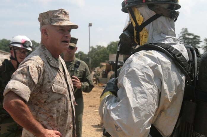 II Marine Expeditionary Force Commanding General Lt.Gen. Dennis Hejlik (left) learns about the Identification and Detection Platoon, CBIRF, from Lance Cpl. Jared Thompson Aug. 13. The Marines assigned to the platoon conduct agent detection and are among the first Marines to enter a contaminated environment.