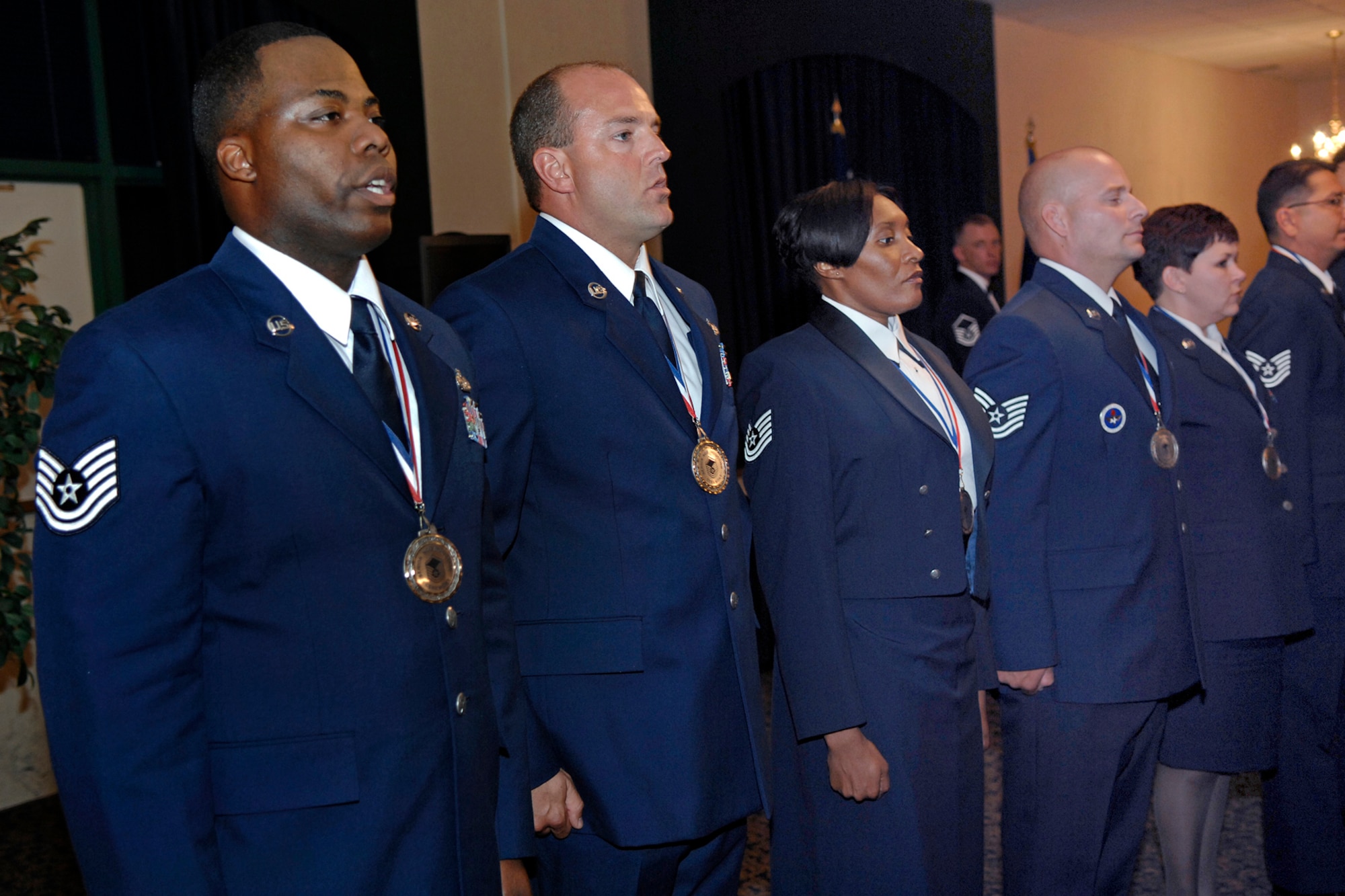 Honorees of the Ellsworth Top Three Association senior NCO induction ceremony recite the Airman's Creed Aug. 13 at the Dakota's club. Forty-three master sergeant selects were honored during the ceremony. (U.S. Air Force photo/Senior Airman Marc I. Lane)